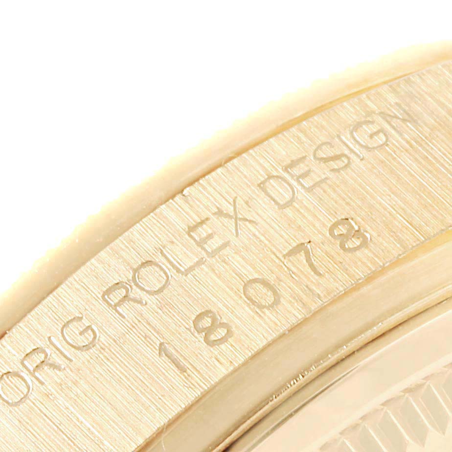 This close-up image shows the side engraving of a Rolex President 18078 Men
s Yellow Gold Champagne Dial 18078 Men
s Yellow Gold Champagne Dial model watch.