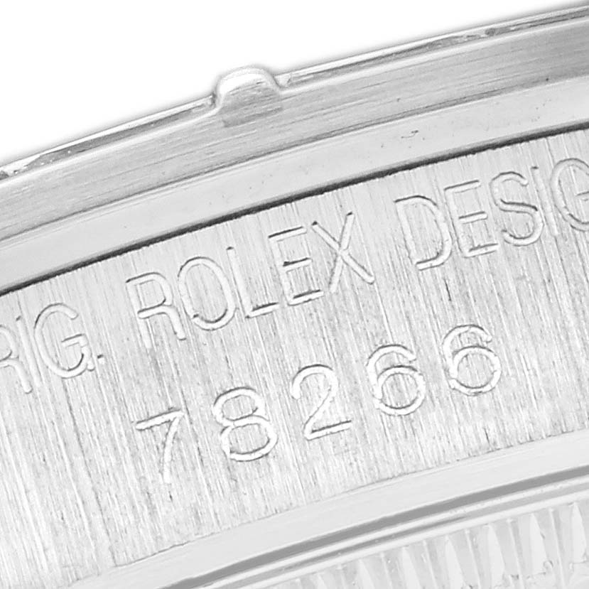 This image shows a close-up of the engraved case back of a Rolex President 78266 Women
s Platinum Blue Dial 78266 Women
s Platinum Blue Dial model watch.