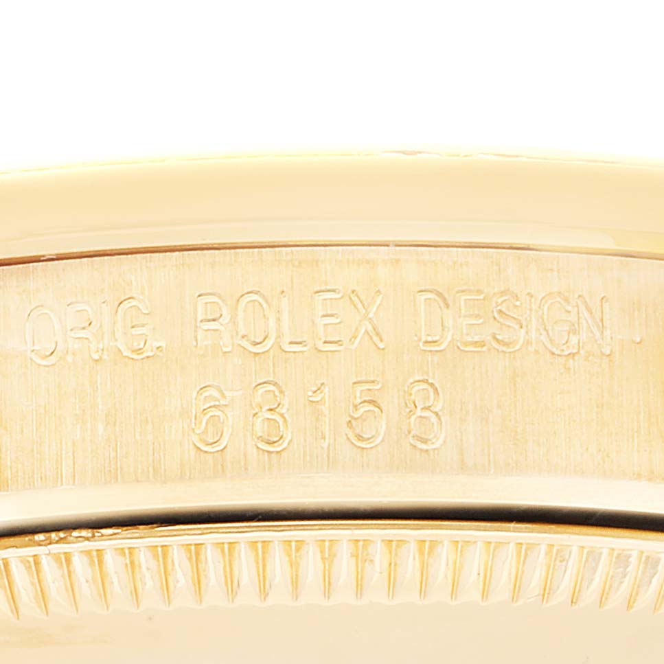 This image shows a close-up of the engraved model number "68158" on the case of a Rolex President 68158 Women
s Yellow Gold Champagne Dial 68158 Women
s Yellow Gold Champagne Dial watch.