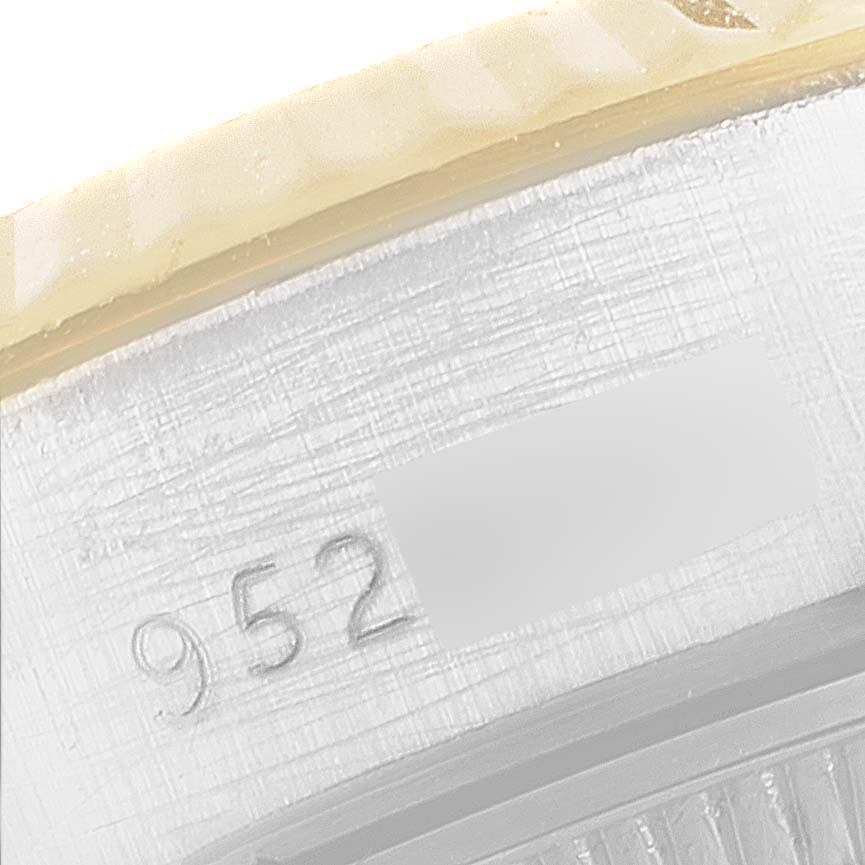 This close-up image shows the serial number engraving on the case of a Rolex President 69179 Women's White Gold White Dial 69179 Women's White Gold White Dial model watch.