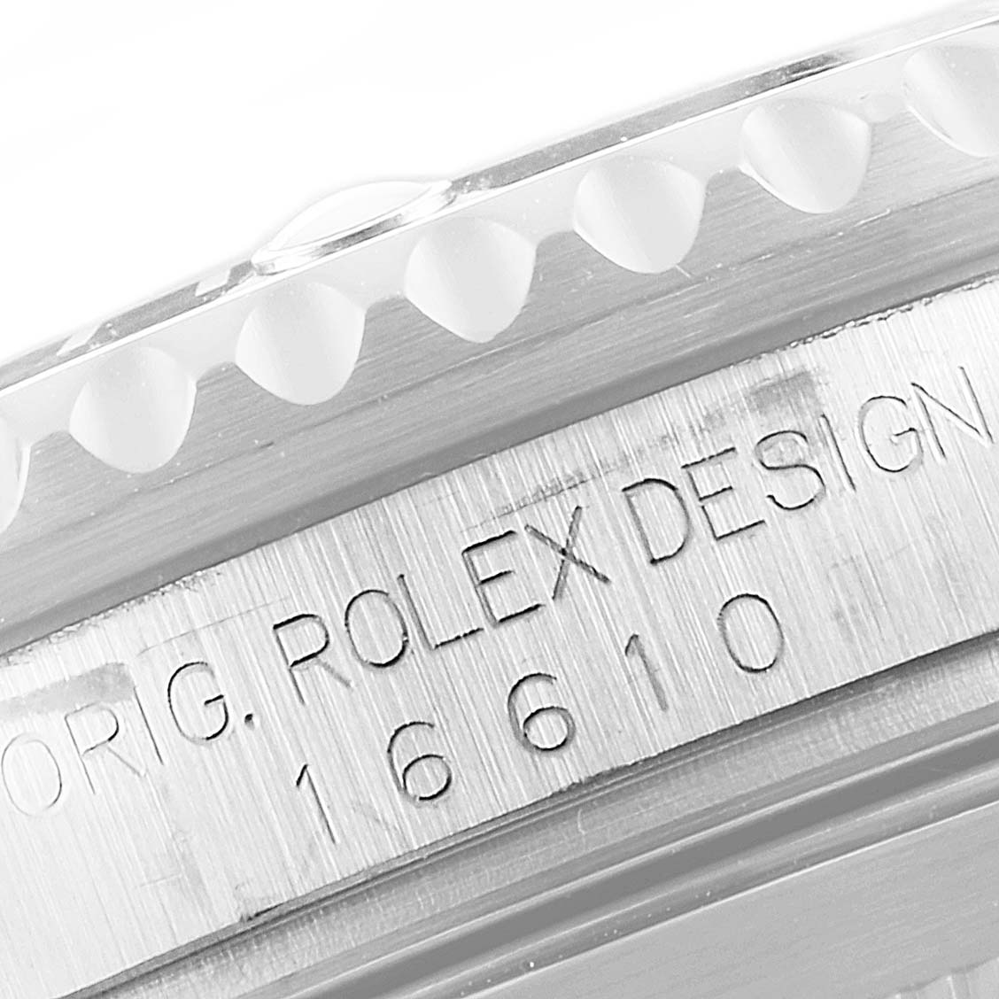 The image shows a close-up of the bezel and engraved casing of a Rolex Submariner 16610 Men
s Stainless Steel Black Dial 16610 Men
s Stainless Steel Black Dial watch model 16610.