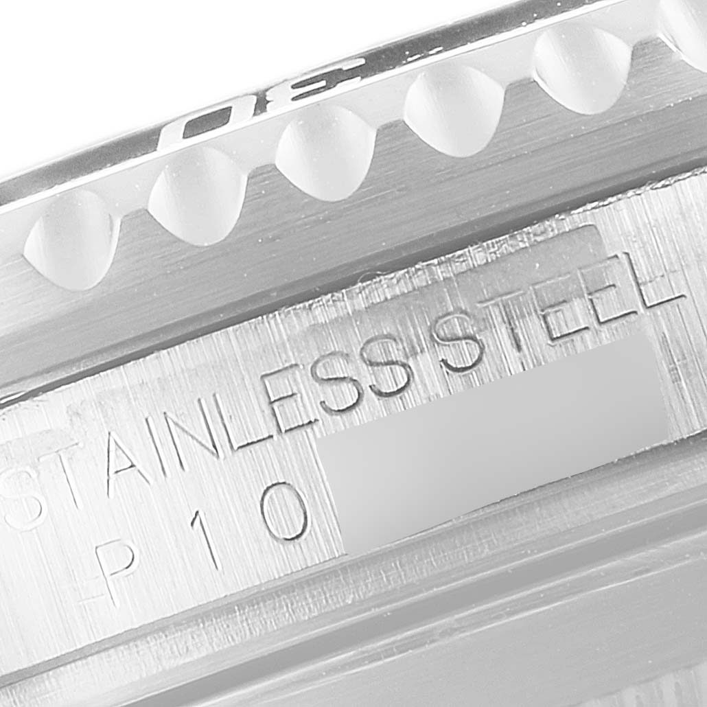 This close-up angle shows the stainless steel engraving and the edge of the bezel of the Rolex Submariner 16610 Men
s Stainless Steel Black Dial 16610 Men
s Stainless Steel Black Dial watch.