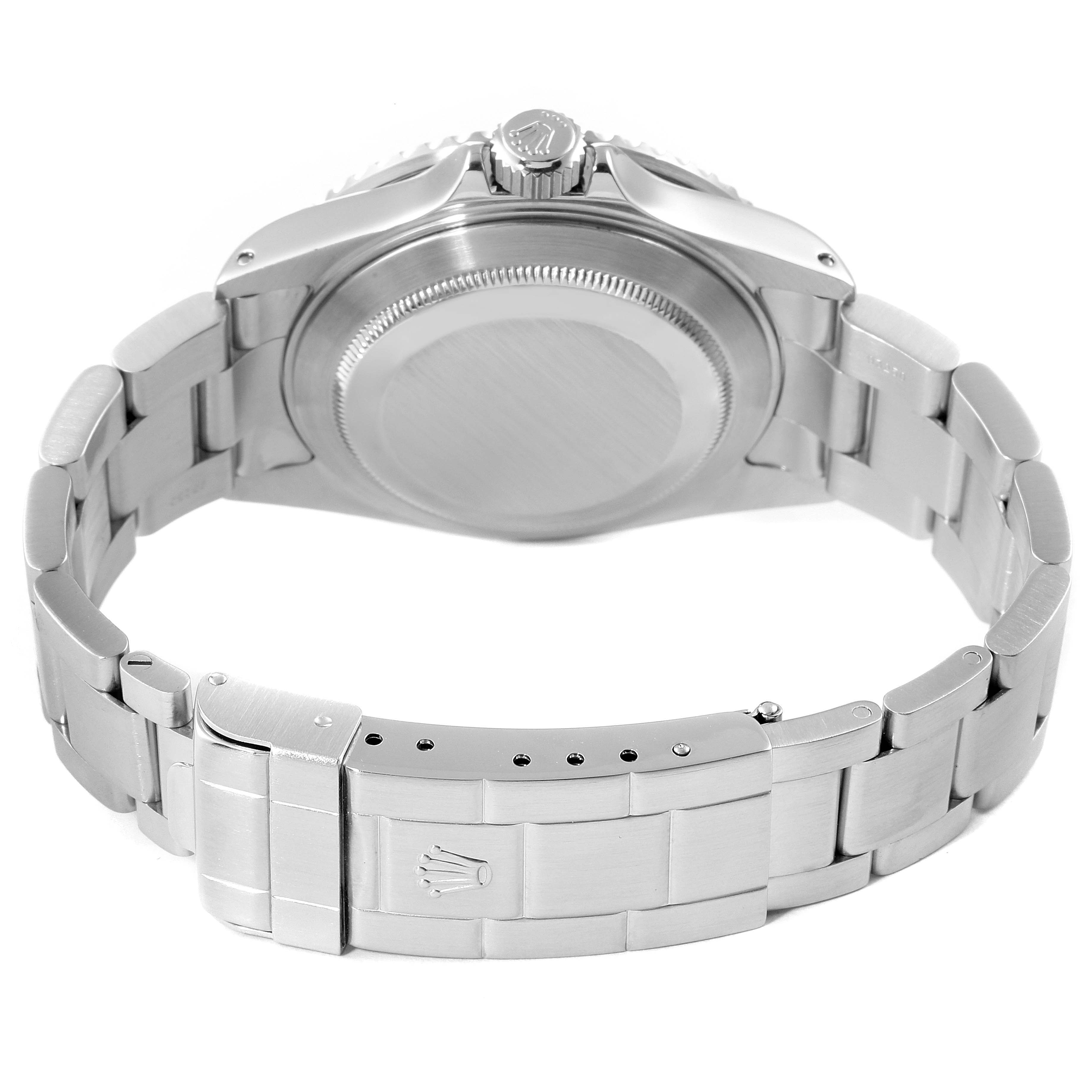 The image shows the back view of a Rolex Submariner 16610 Men
s Stainless Steel Black Dial 16610 Men
s Stainless Steel Black Dial watch, focusing on the case back and the clasp of the bracelet.