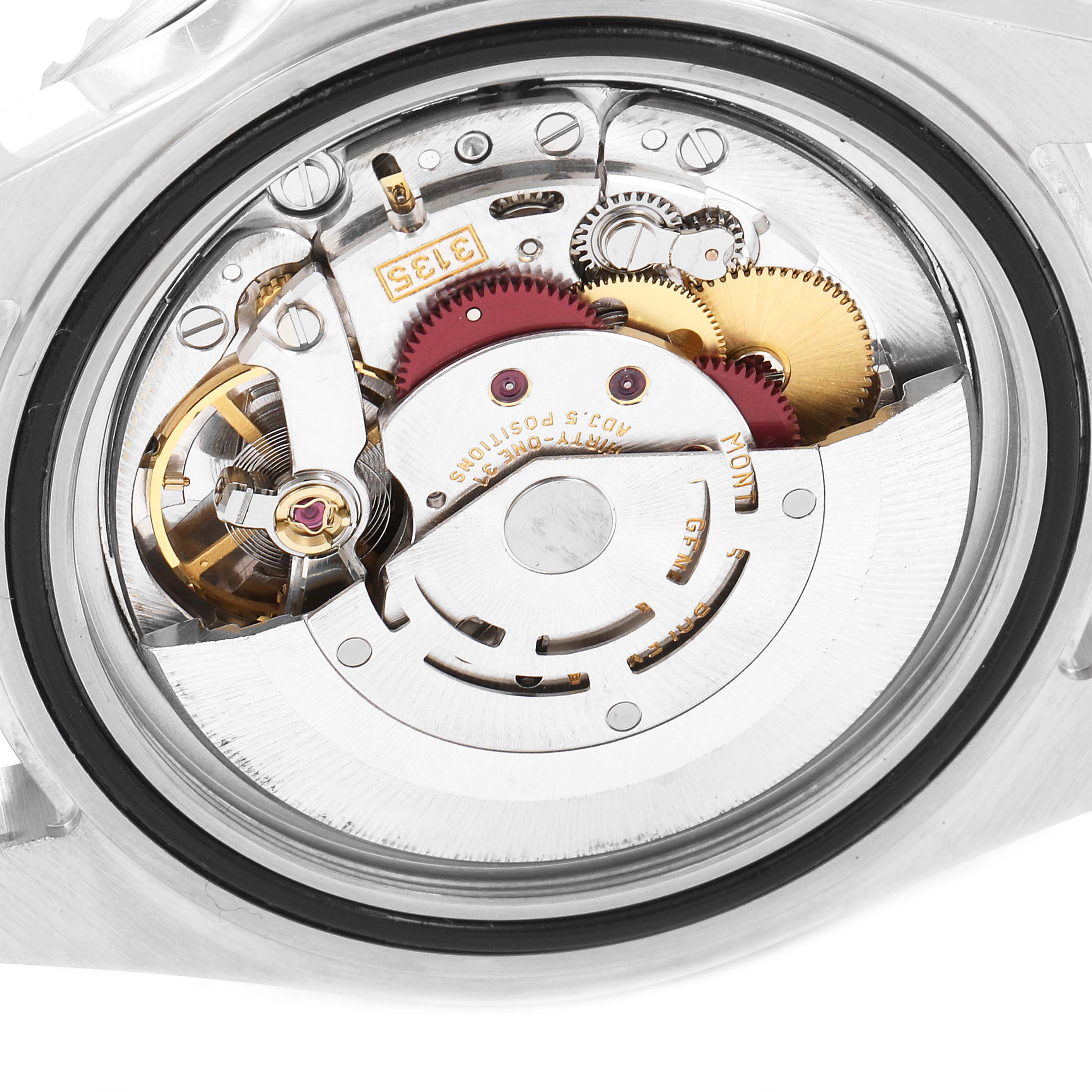 This image shows a close-up view of the movement and inner workings of a Rolex Submariner 16610 Men
s Stainless Steel Black Dial 16610 Men
s Stainless Steel Black Dial watch.