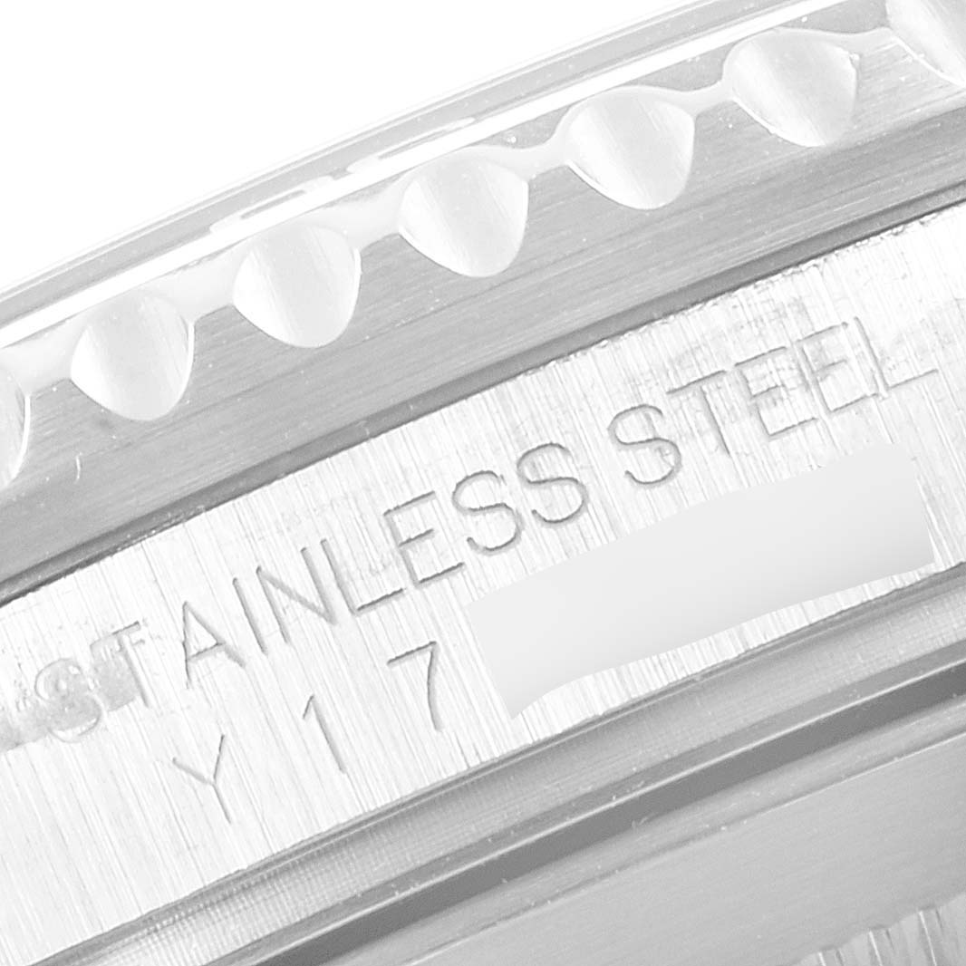 This image shows a close-up of the stainless steel engraved bezel of a Rolex Submariner 16610 Men
s Stainless Steel Black Dial 16610 Men
s Stainless Steel Black Dial watch.