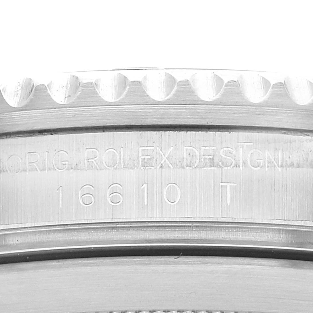 The image shows a close-up of the case side, particularly the reference number, of a Rolex Submariner 16610 Men
s Stainless Steel Black Dial 16610 Men
s Stainless Steel Black Dial watch.