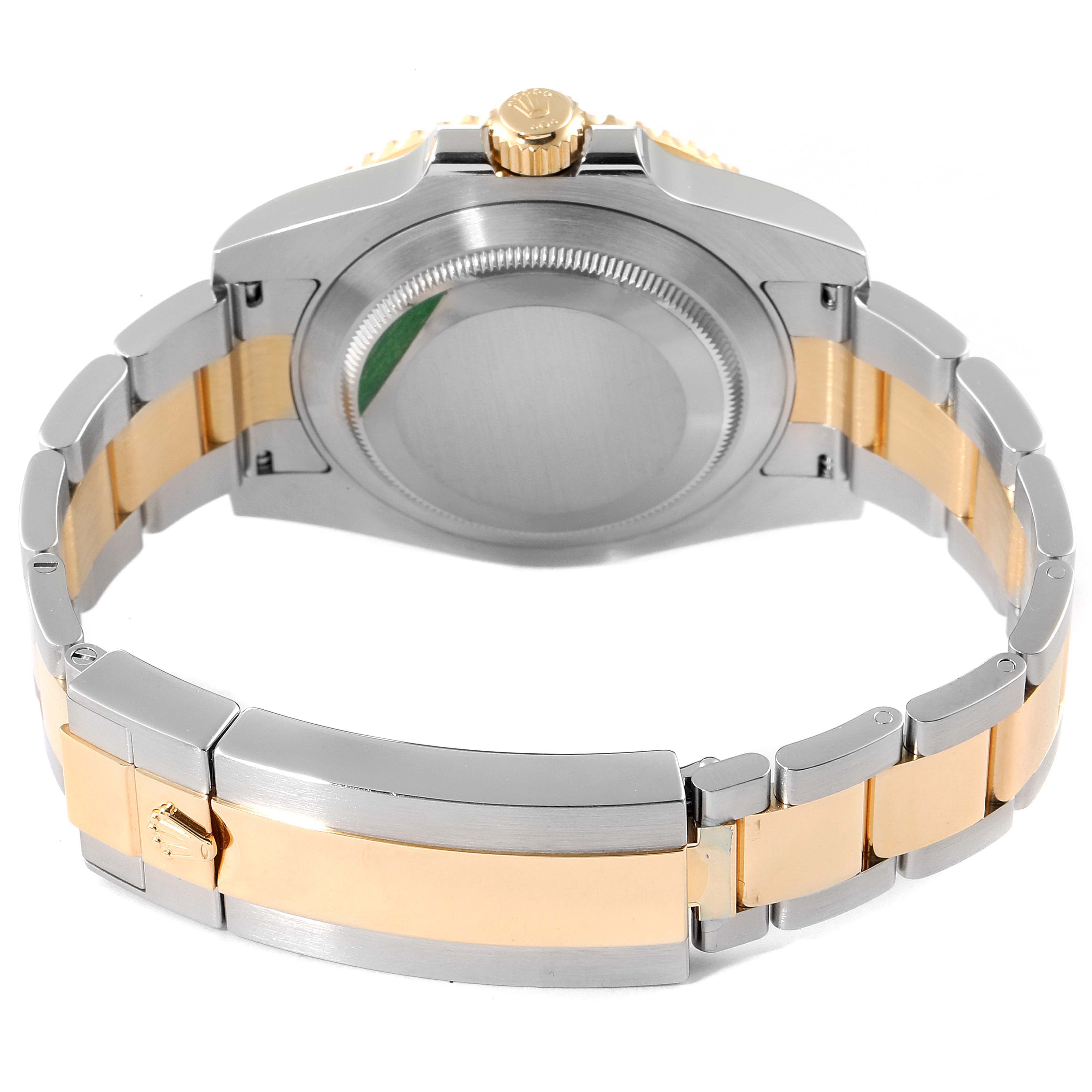 This is a rear view of the Rolex Submariner 116613 Men
s Steel and Gold (two tone) Blue Dial 116613 Men
s Steel and Gold (two tone) Blue Dial watch showing its case back and two-tone bracelet with the clasp visible.