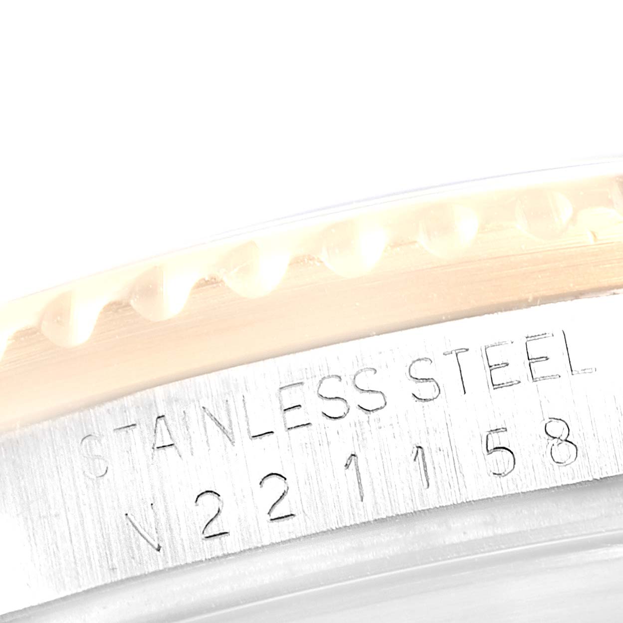 This image shows a close-up of the bezel and case of a Rolex Submariner 16613 Men
s Steel and Gold (two tone) Champagne Dial 16613 Men
s Steel and Gold (two tone) Champagne Dial, highlighting the model details and stainless steel stamp.