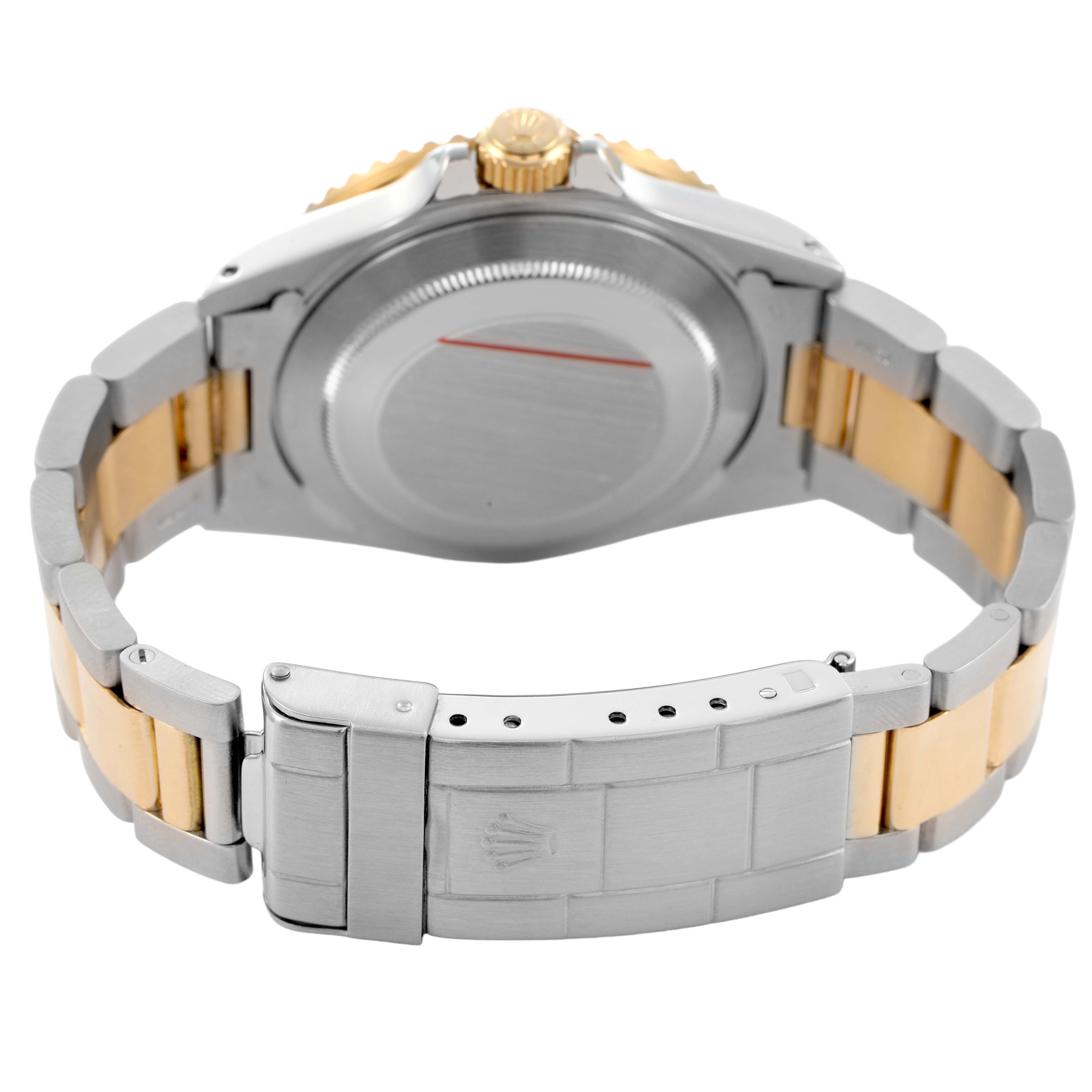 The image shows the back of a Rolex Submariner 16803 Men's Steel and Gold (two tone) Black Dial, highlighting the clasp, bracelet links, and case back.