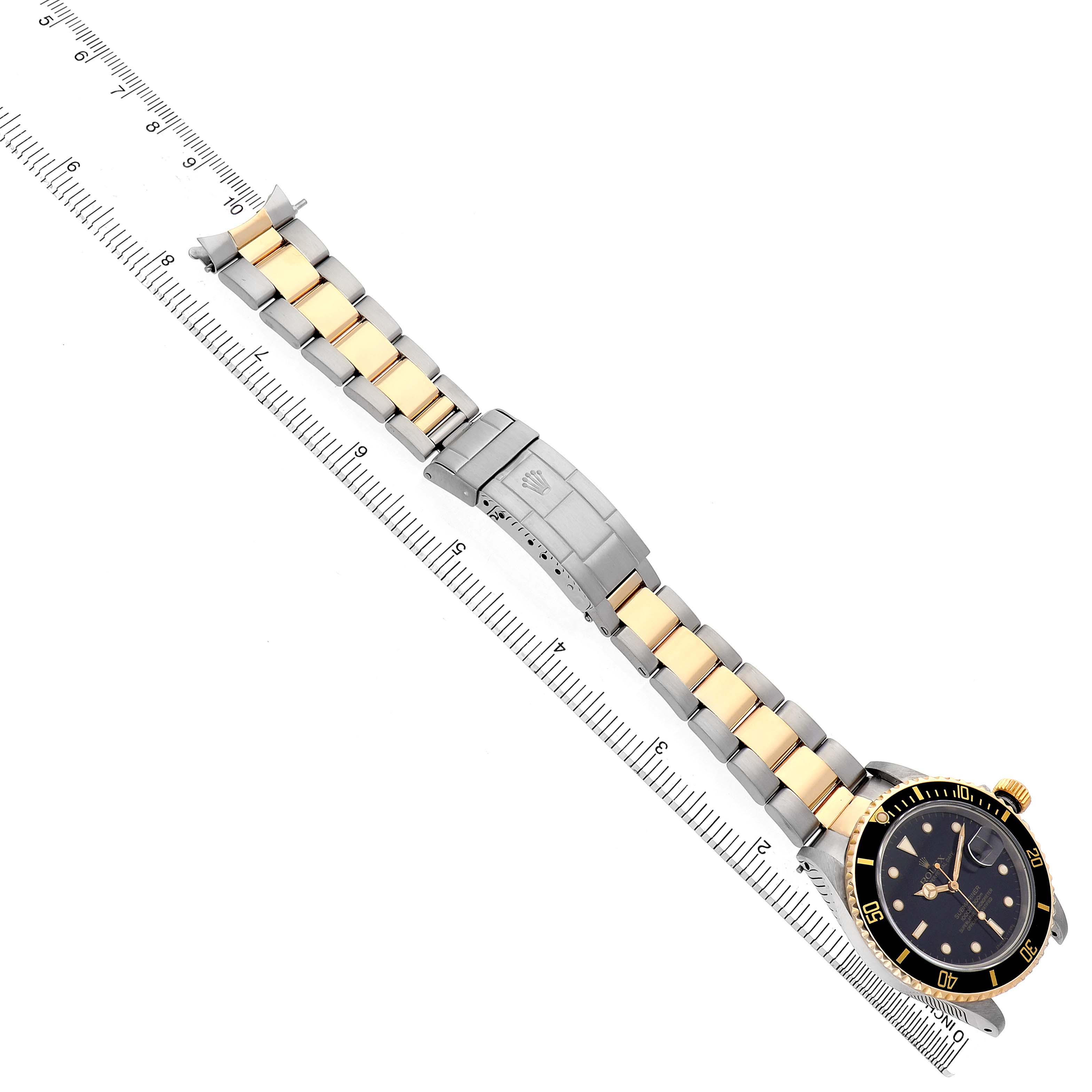 The Rolex Submariner 16803 Men's Steel and Gold (two tone) Black Dial watch is shown from an overhead angle, highlighting the bracelet, clasp, and bezel.