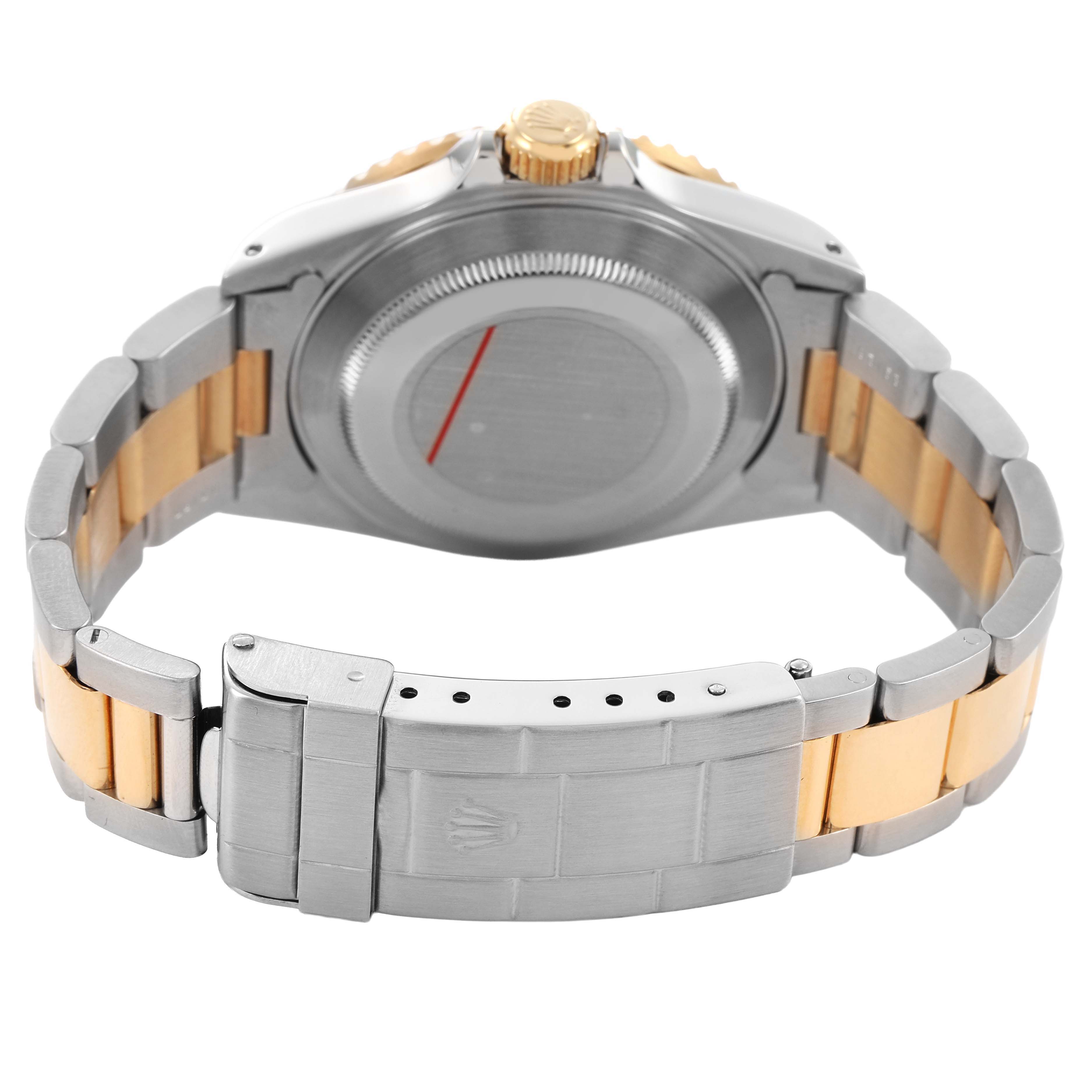 The image shows the back of a Rolex Submariner 16613LB Men's Stainless Steel Blue Dial, highlighting its case back, bracelet, and clasp with a two-tone design.