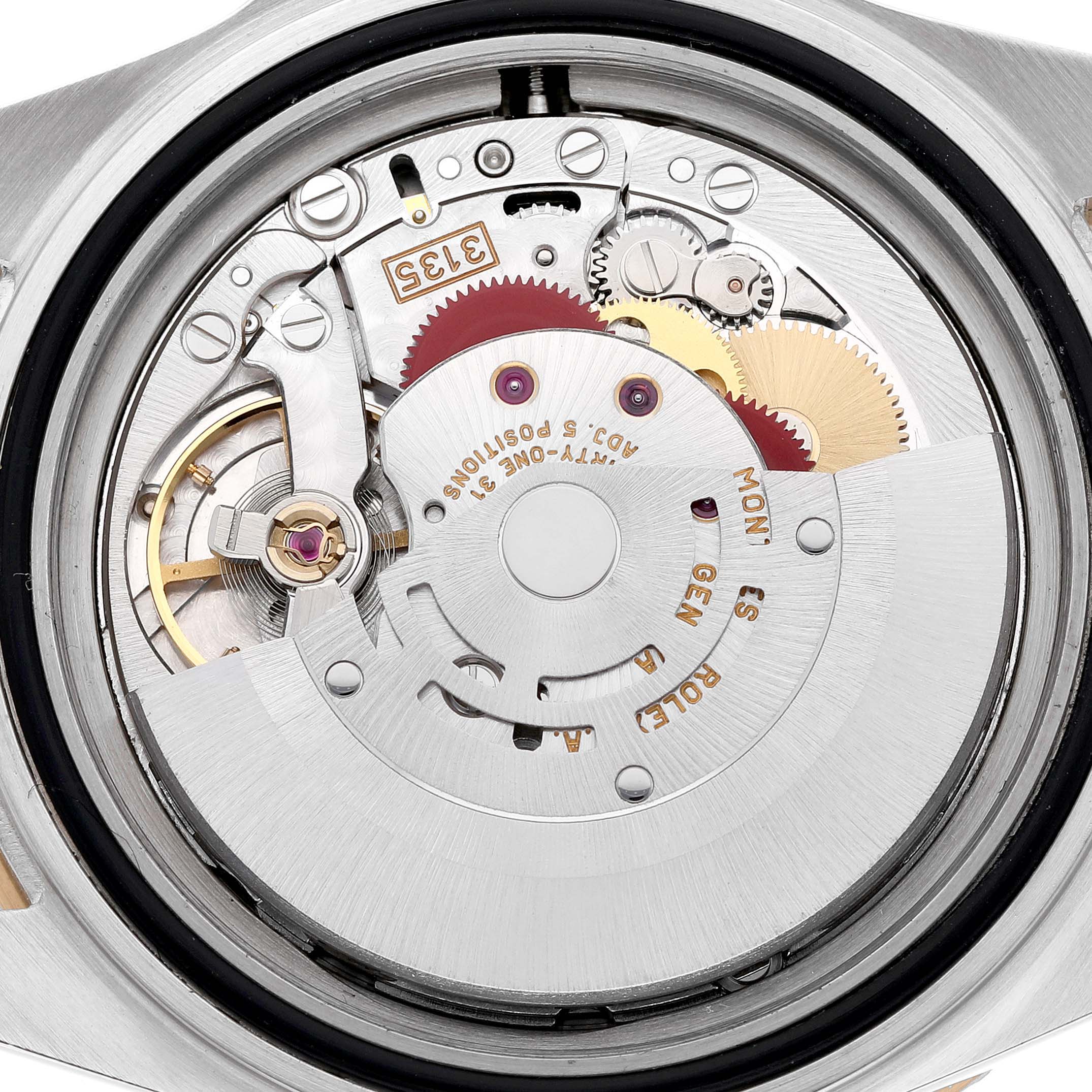 The image shows the inner mechanical movement of a Rolex Submariner 16613LB Men's Stainless Steel Blue Dial, viewed from the back, highlighting gears and components.