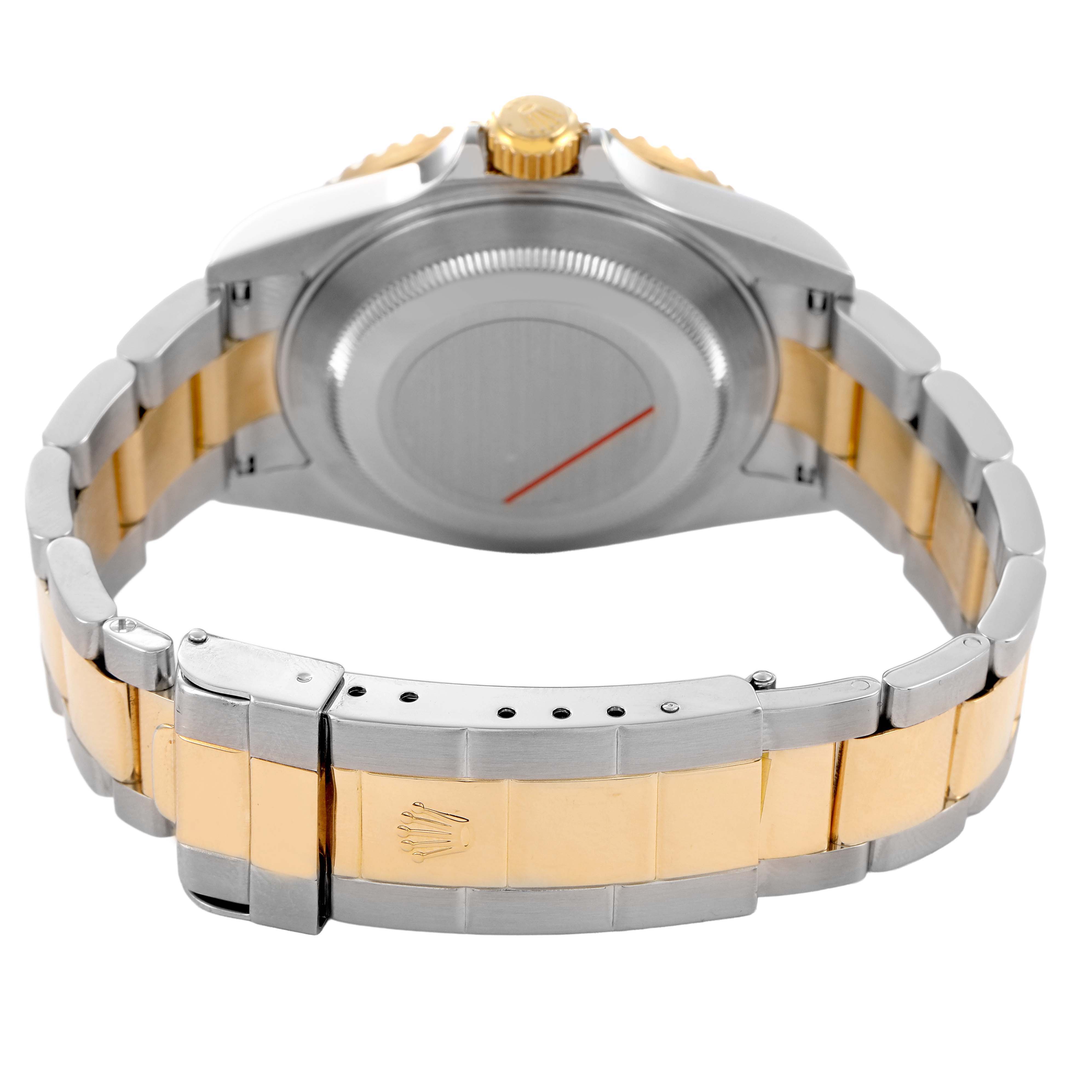 The image shows a Rolex Submariner 16613LB Men's Steel and Gold (two tone) Blue Dial from the back angle, highlighting the case back, crown, and two-tone bracelet clasp.