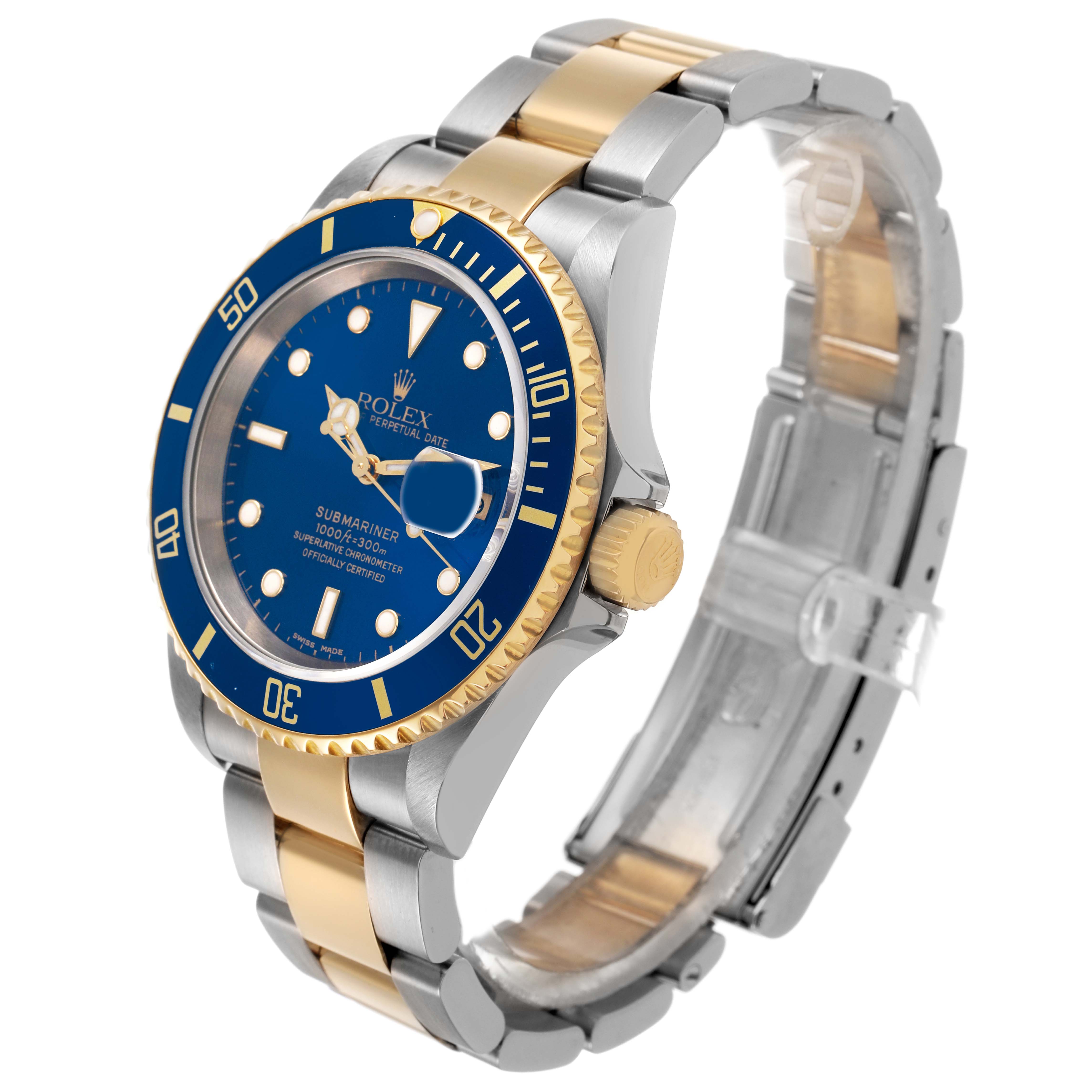 The Rolex Submariner 16613LB Men's Steel and Gold (two tone) Blue Dial watch is shown at an oblique angle, highlighting its dial, bezel, crown, and two-tone bracelet.