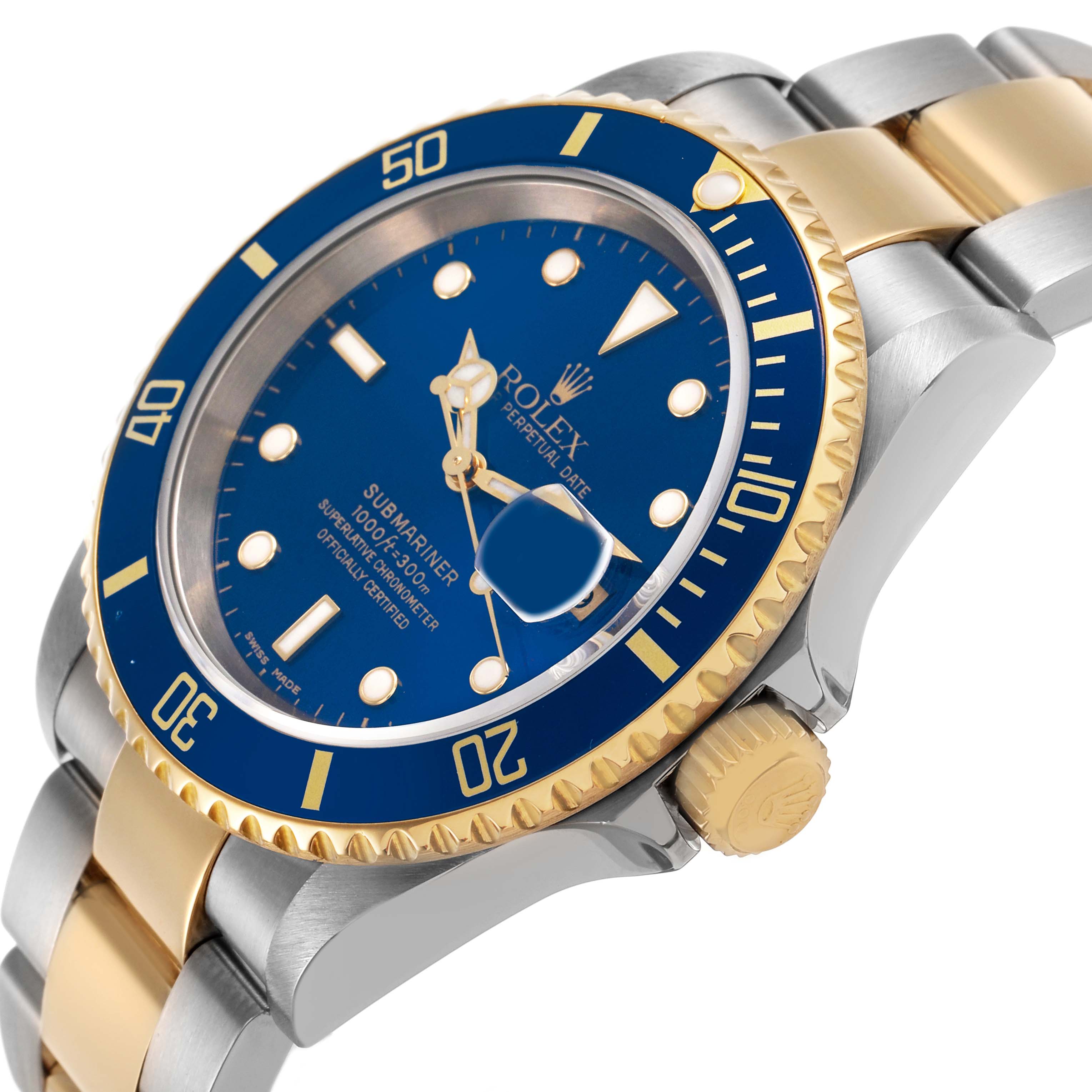 The Rolex Submariner 16613LB Men's Steel and Gold (two tone) Blue Dial watch is shown at a three-quarter angle, highlighting the blue dial, gold bezel, and two-tone bracelet.