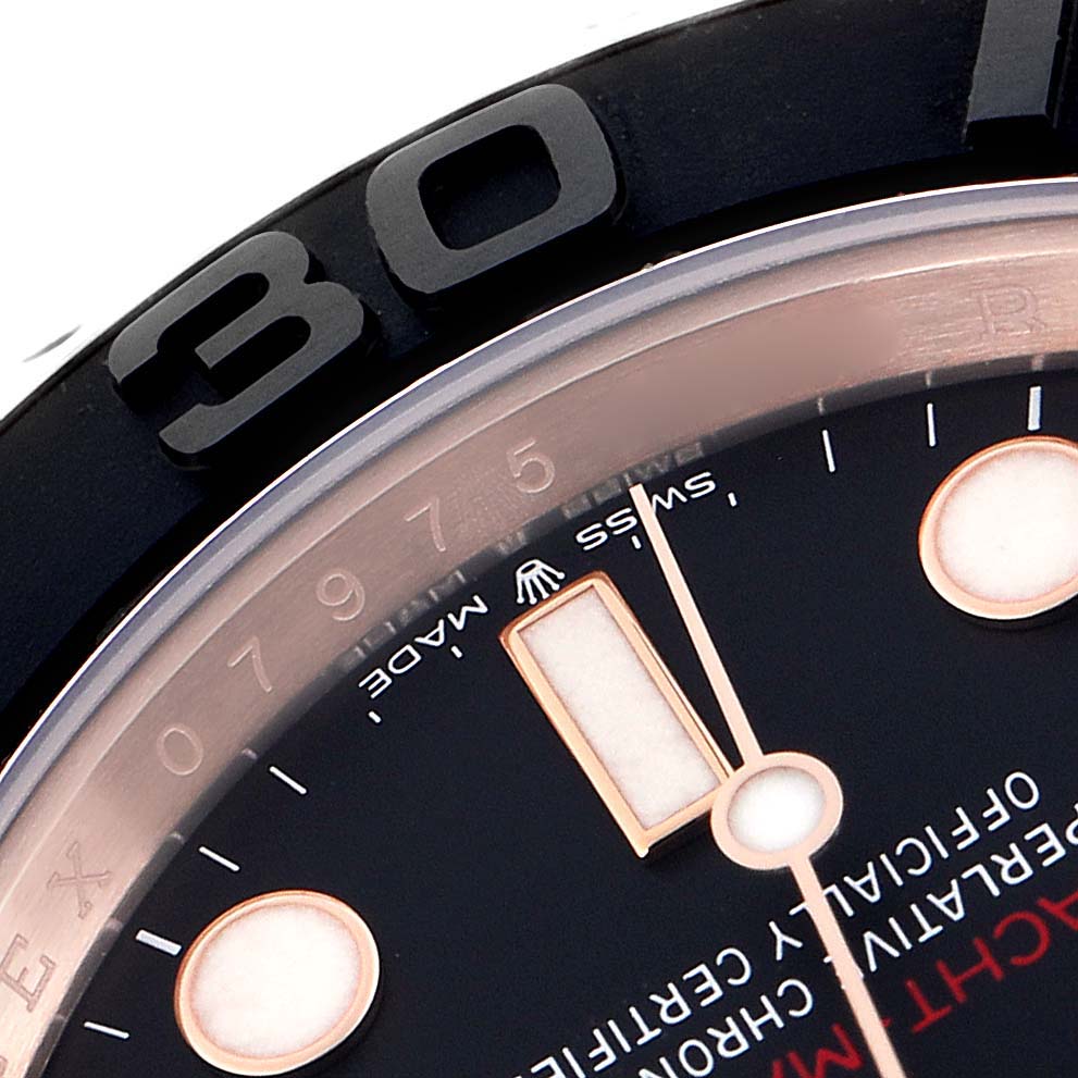 The image shows a close-up of the Rolex Yacht-Master model 126655, highlighting the black bezel, part of the dial, and hour markers.