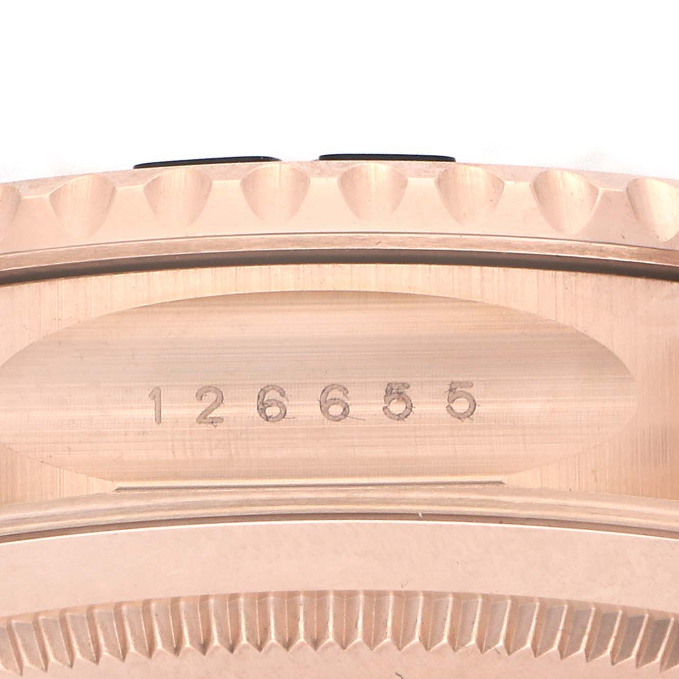 The image shows a close-up of the Rolex Yacht-Master model number 126655, focusing on the engraved side of the watch case.