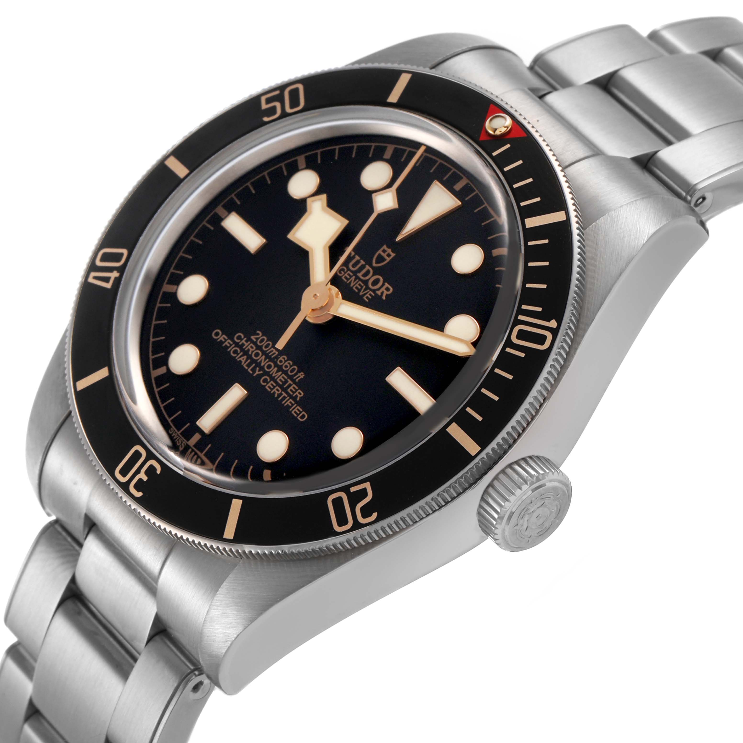 The Tudor Heritage Black Bay M79030N-0001 Men's Stainless Steel Black Dial watch is shown at a tilted angle highlighting the bezel, dial, crown, and stainless steel bracelet.