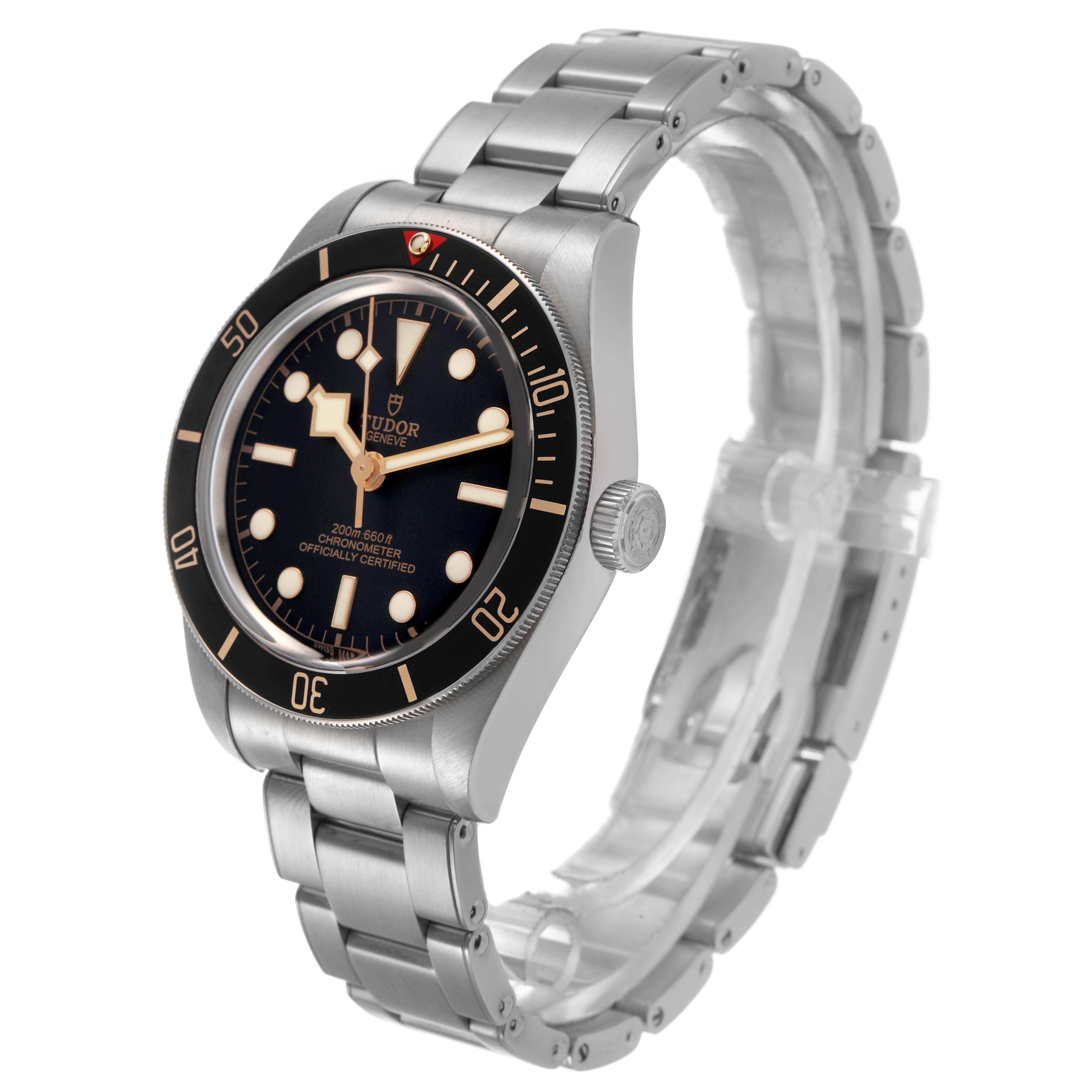 The Tudor Heritage Black Bay M79030N-0001 Men's Stainless Steel Black Dial watch is shown at an oblique angle, highlighting the face, bezel, crown, and metal bracelet.