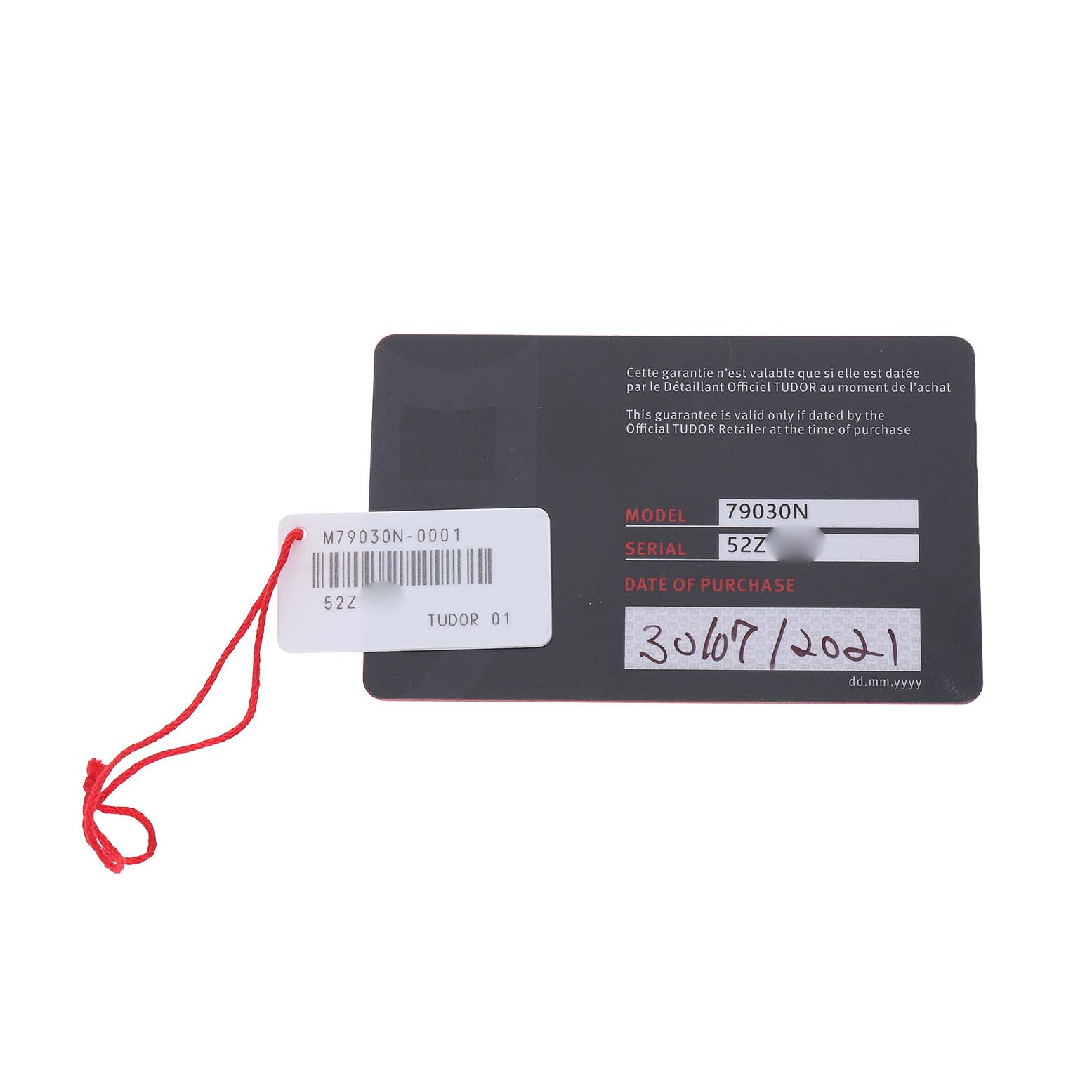 The image shows a warranty card for the Tudor Heritage Black Bay M79030N-0001 Men's Stainless Steel Black Dial watch, displaying model and serial numbers.