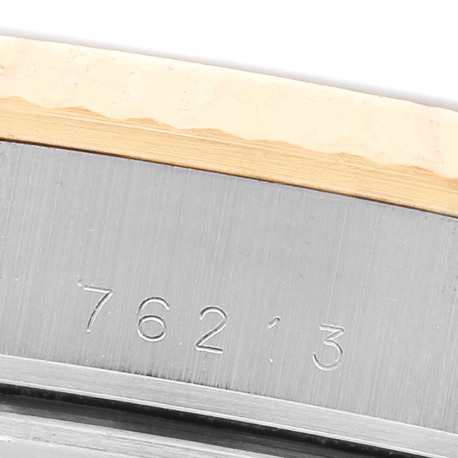 The image shows a close-up of the Tudor Prince M76213 Men's Steel and Gold (two tone) Champagne Dial model's bezel edge and engraved serial number.