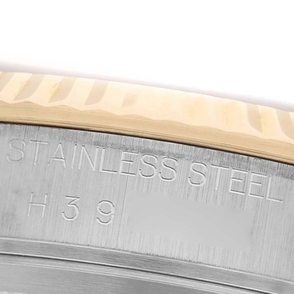 The image shows a close-up of the Tudor Prince M76213 Men's Steel and Gold (two tone) Champagne Dial model's bezel and stainless steel engraving.