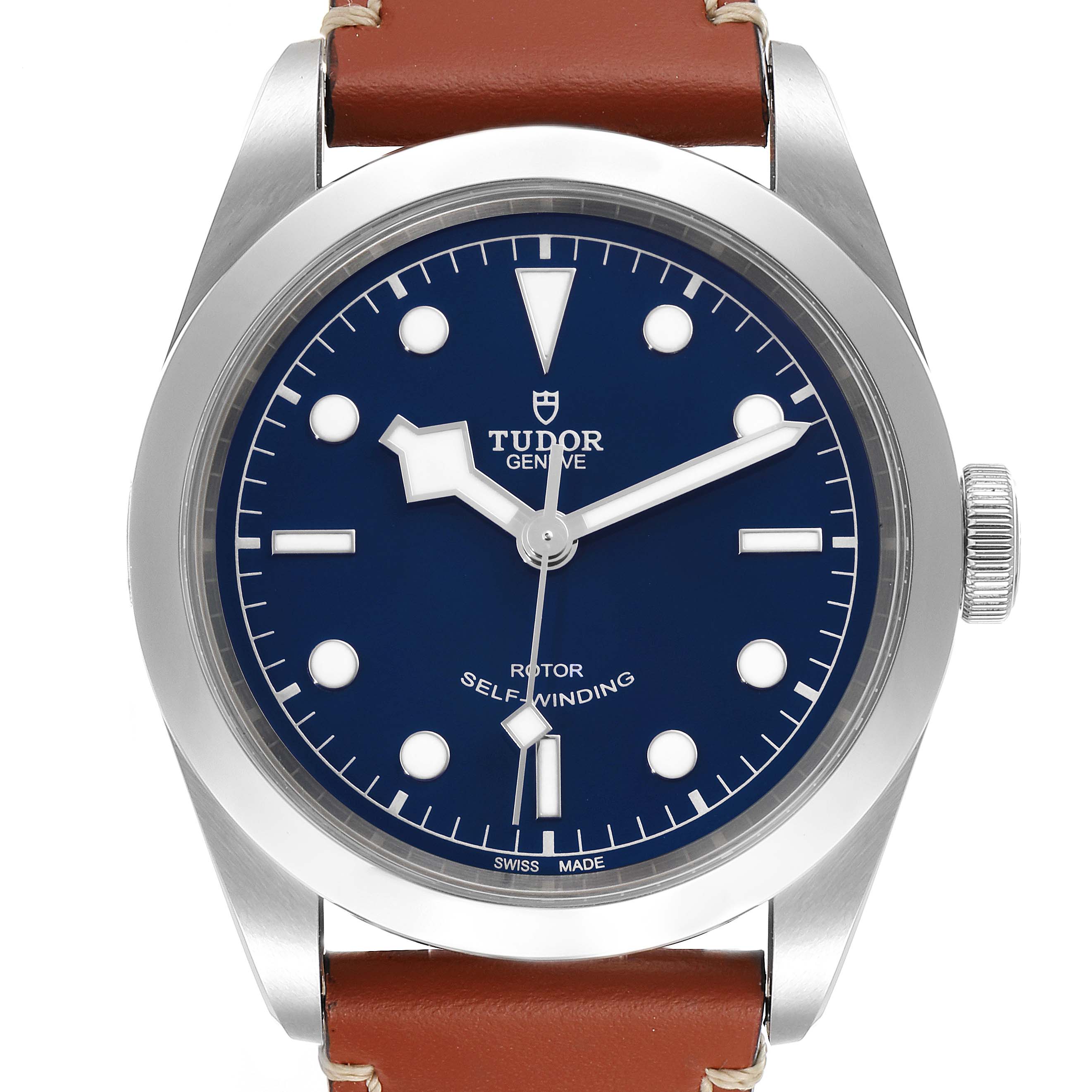 The image shows a front view of a Tudor Heritage Black Bay 79540 Men's Stainless Steel Blue Dial 79540 Men's Stainless Steel Blue Dial watch, displaying the face, bezel, and part of the brown leather strap.