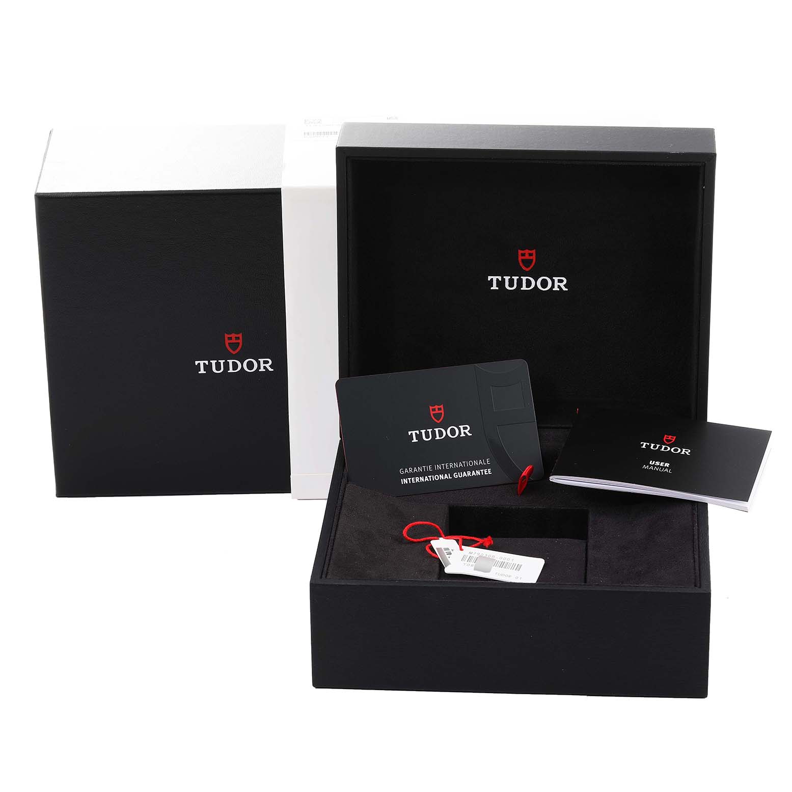 This image shows the packaging, international guarantee card, and user manual for the Tudor Heritage Black Bay 79030B Men's Stainless Steel Blue Dial 79030B Men's Stainless Steel Blue Dial watch.
