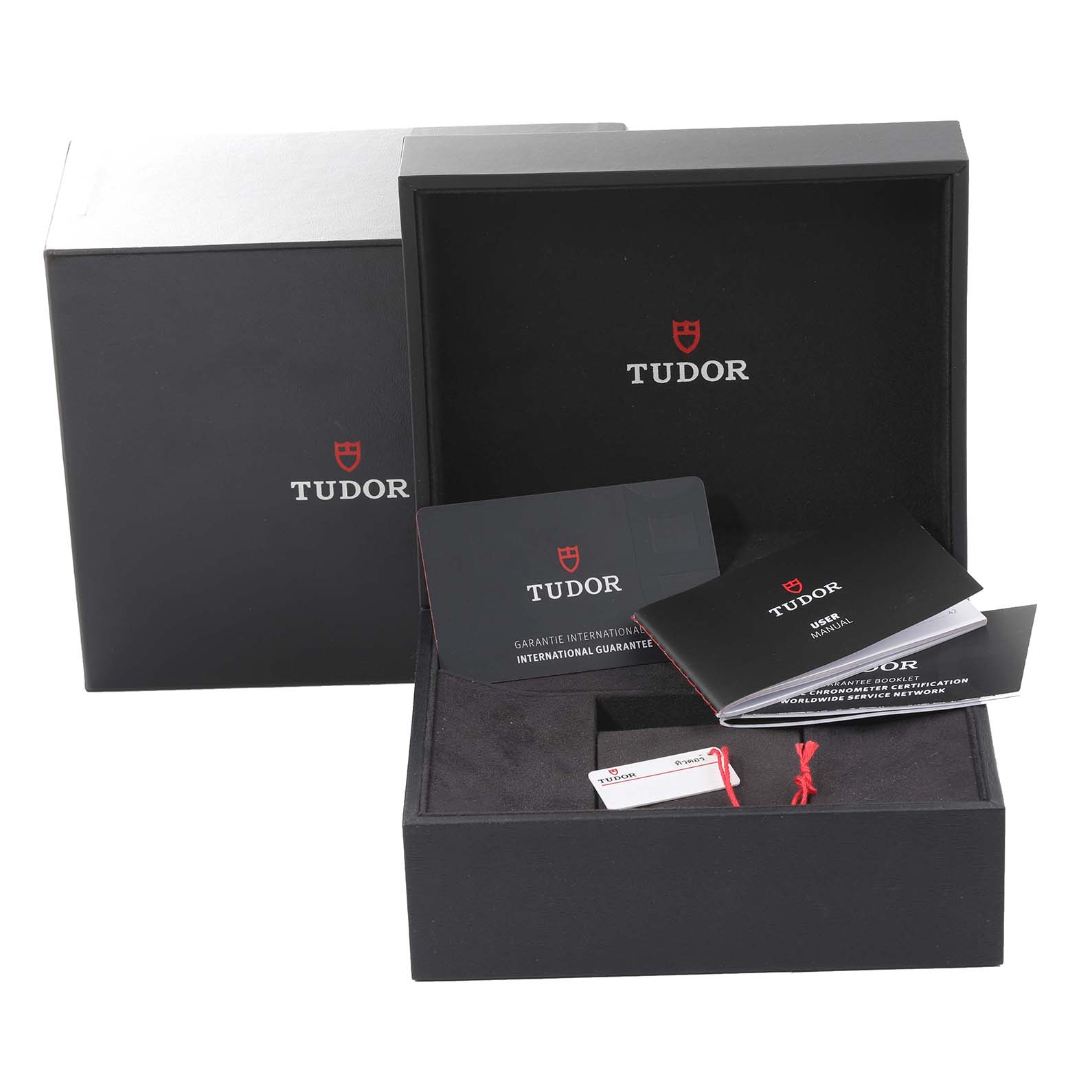 The image shows the packaging, including the outer box, inner box, warranty card, and manual for the Tudor Heritage Black Bay M79010SG-0002 Men's Stainless Steel Grey Dial M79010SG-0002 Men's Stainless Steel Grey Dial watch model.