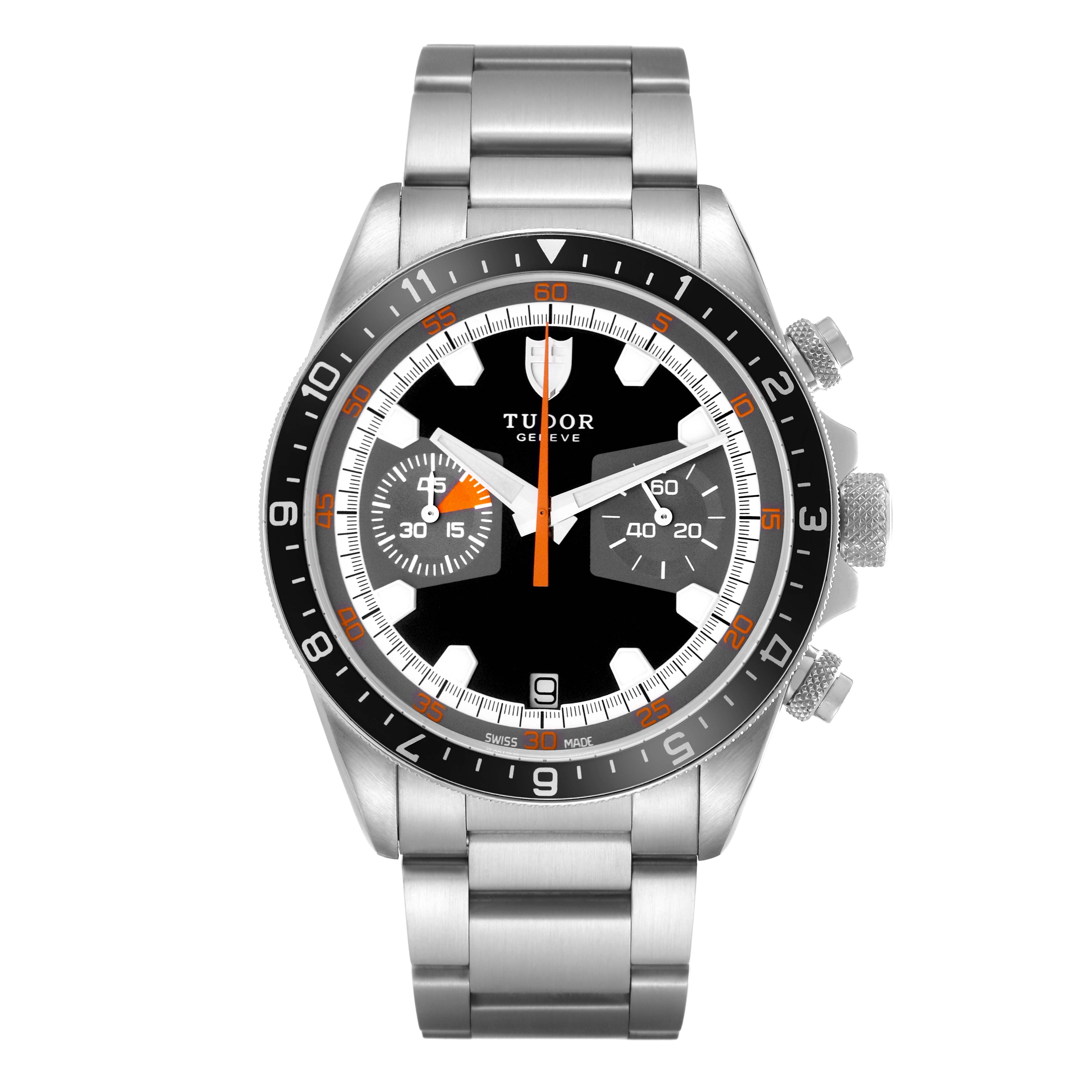 The Tudor Heritage Chrono 70330N-65740 watch is shown from the front, displaying the dial, bezel, and bracelet with a focus on the chronograph features.