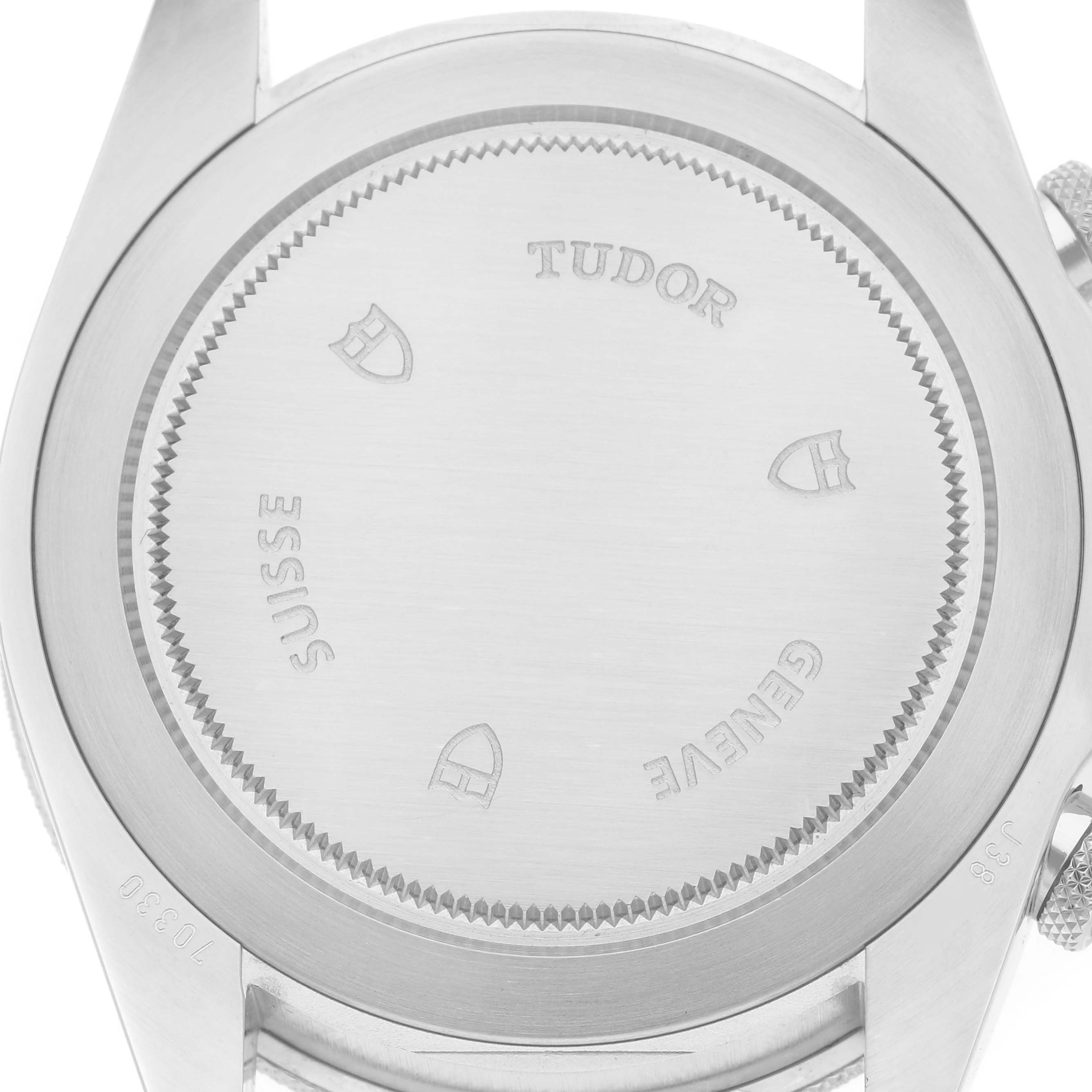 The image shows the back case of the Tudor Heritage Chrono, model 70330N-65740, featuring etched branding and the model number.