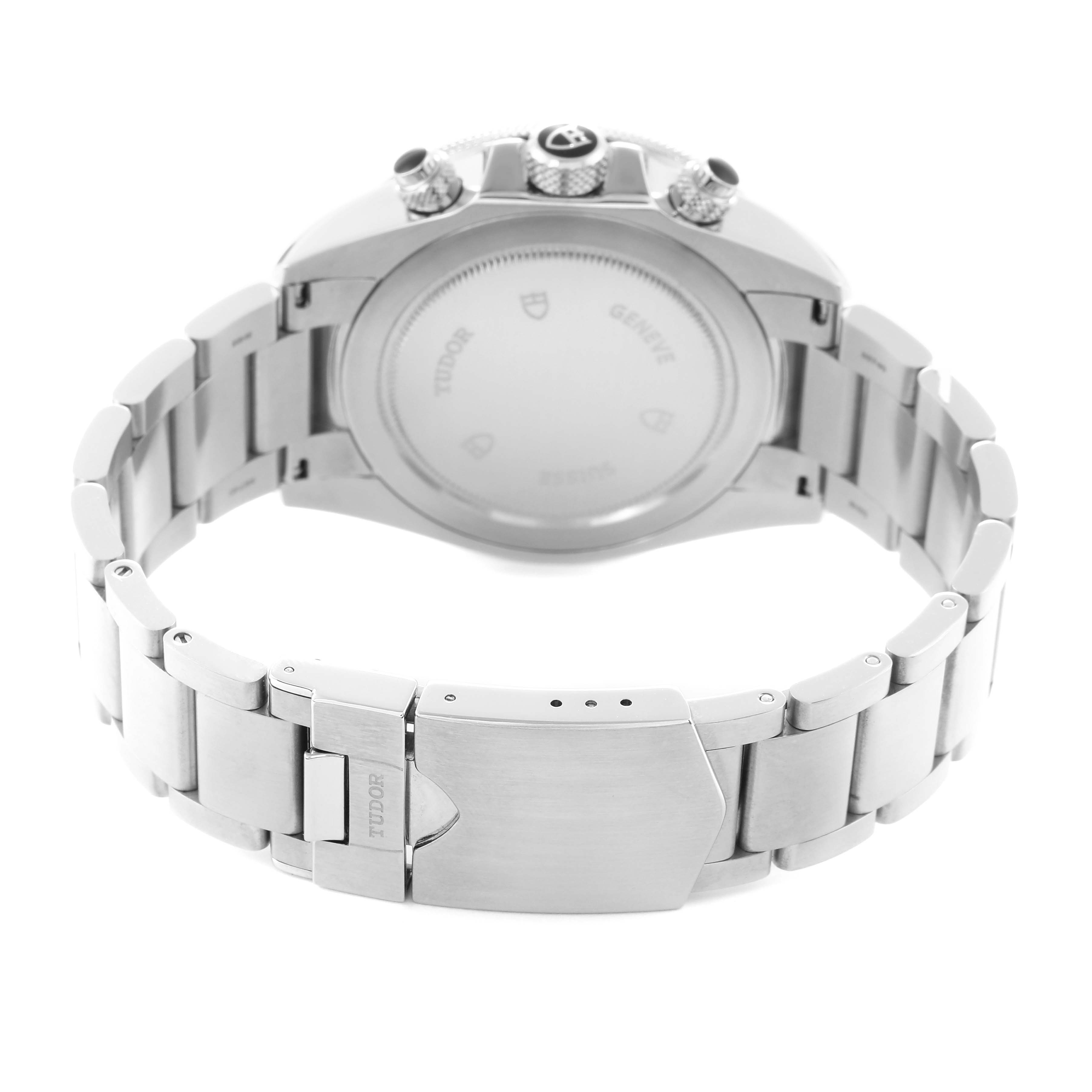 The image shows the rear view of the Tudor Heritage Chrono model number 70330N-65740, highlighting the metal bracelet and closed clasp.