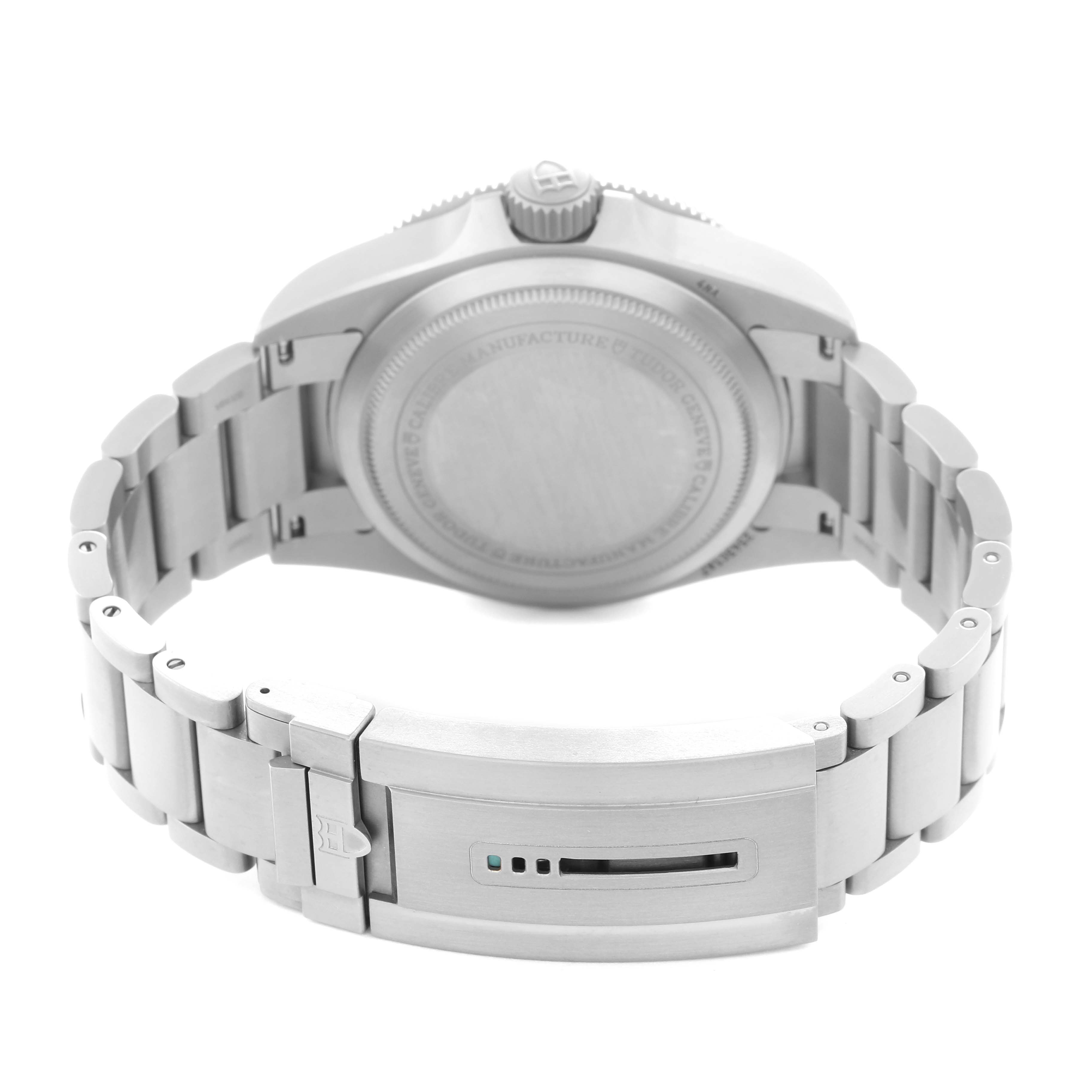 The image shows the back view of a Tudor Pelagos Men's watch, model number M2543C1A7NU-0001, highlighting its case back, bracelet, and clasp.