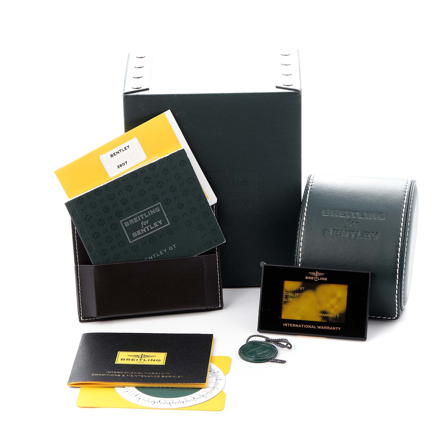 The image shows Breitling Bentley A13362 Men
s Stainless Steel Mother of Pearl Dial A13362 Men
s Stainless Steel Mother of Pearl Dial watch accessories including boxes, manuals, a warranty card, and a tag from a front angle.