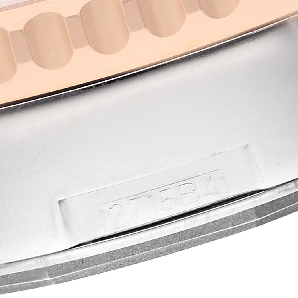 This close-up image shows the side of the bezel and part of the case of a Breitling Navitimer UB0127 Men
s Steel and Gold (two tone) Black Dial UB0127 Men
s Steel and Gold (two tone) Black Dial watch.