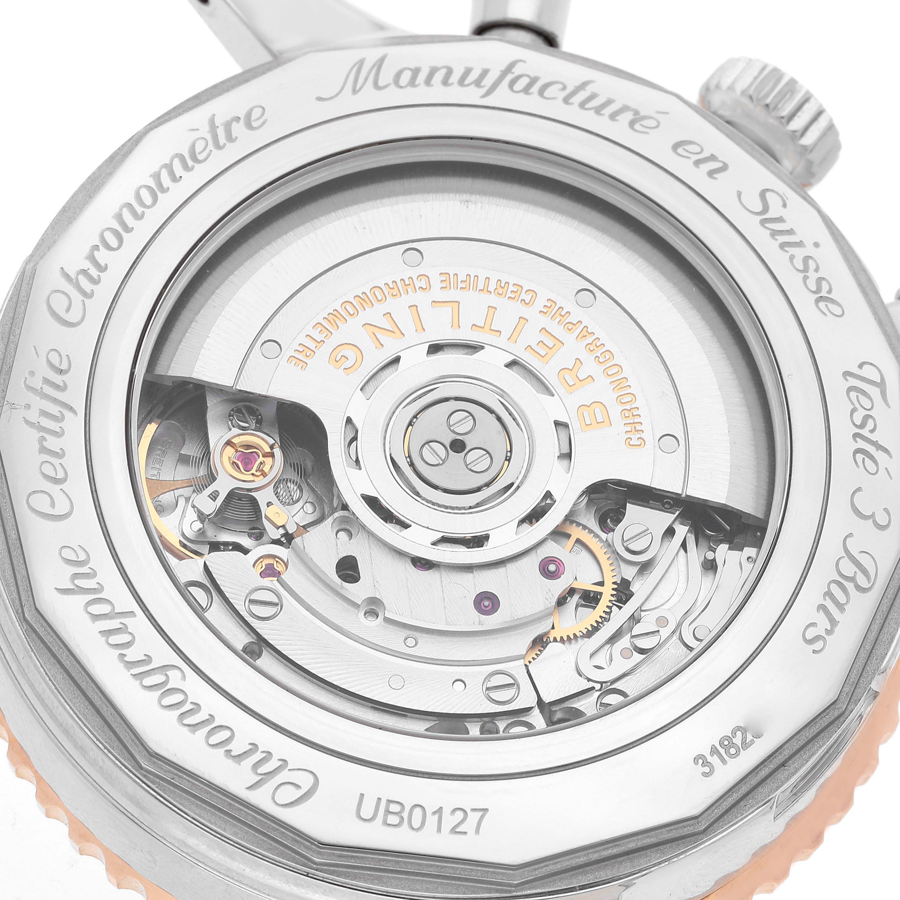 This image shows the back view of a Breitling Navitimer UB0127 Men
s Steel and Gold (two tone) Black Dial UB0127 Men
s Steel and Gold (two tone) Black Dial watch, highlighting its intricate internal mechanisms.