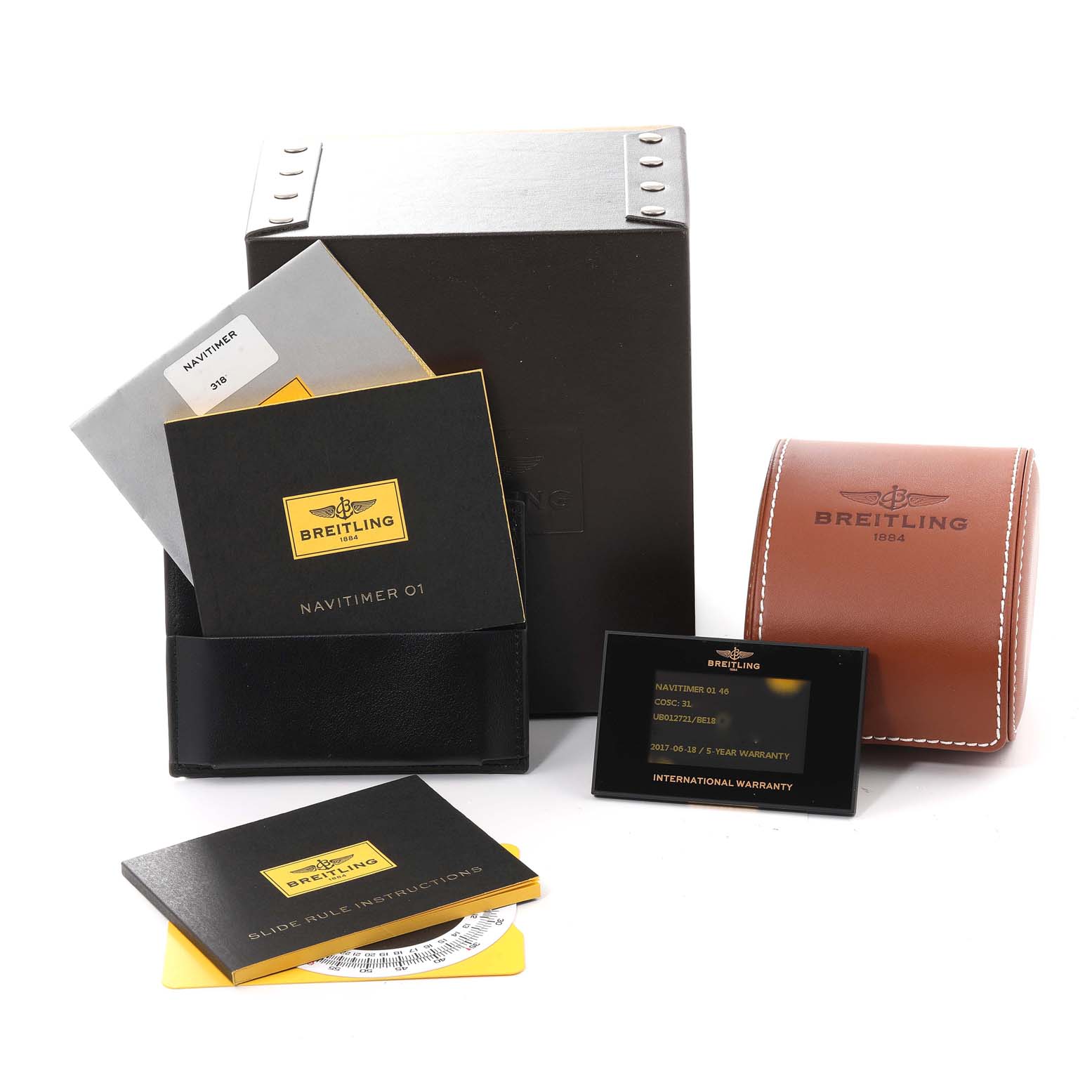 The image shows accessories for the Breitling Navitimer UB0127 Men
s Steel and Gold (two tone) Black Dial UB0127 Men
s Steel and Gold (two tone) Black Dial model, including manuals, a case, warranty card, and a leather pouch.