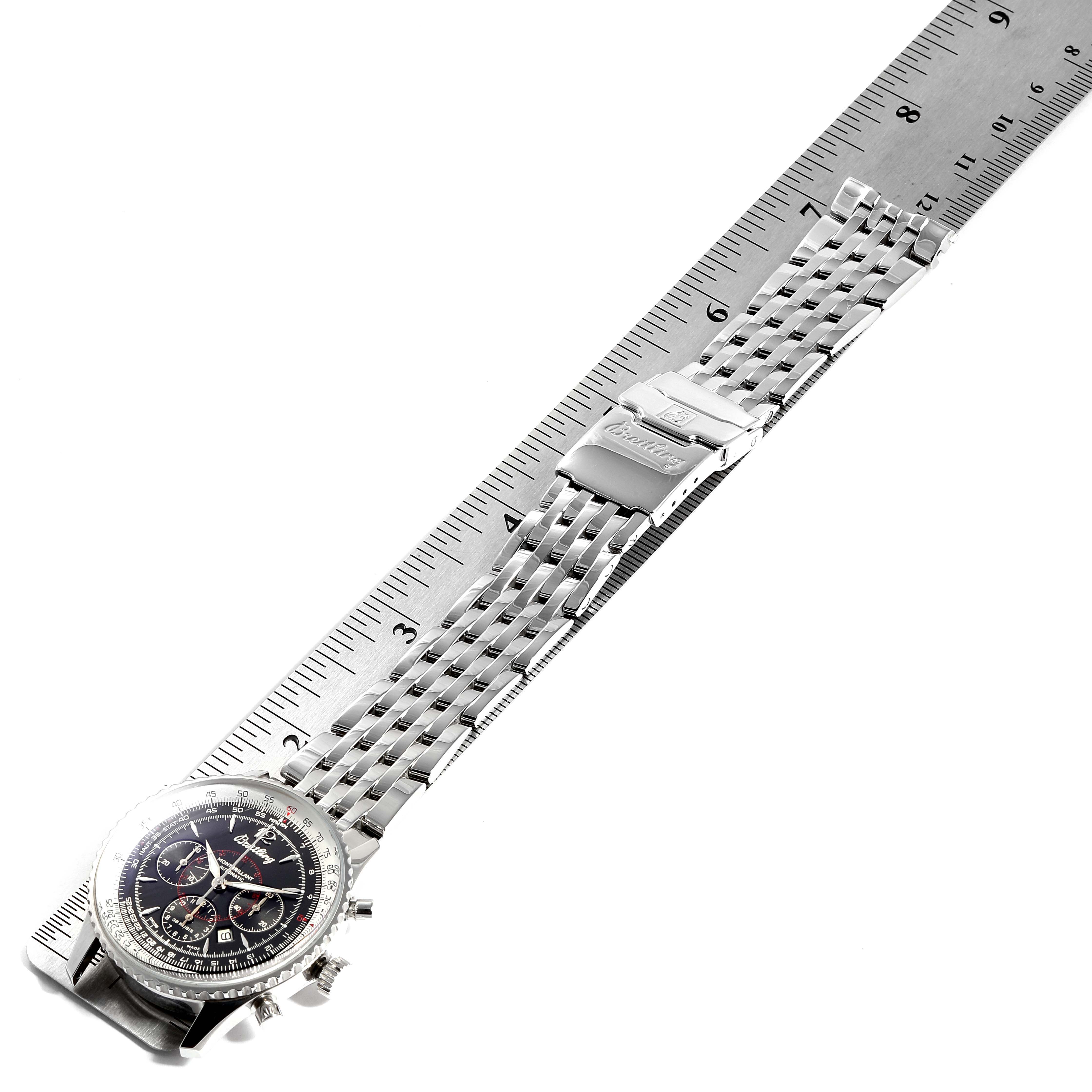The Breitling Navitimer A41330 Men
s Stainless Steel Black Dial A41330 Men
s Stainless Steel Black Dial watch is shown in a top-down angle, displaying its face, bezel, bracelet, and clasp alongside a ruler for scale.