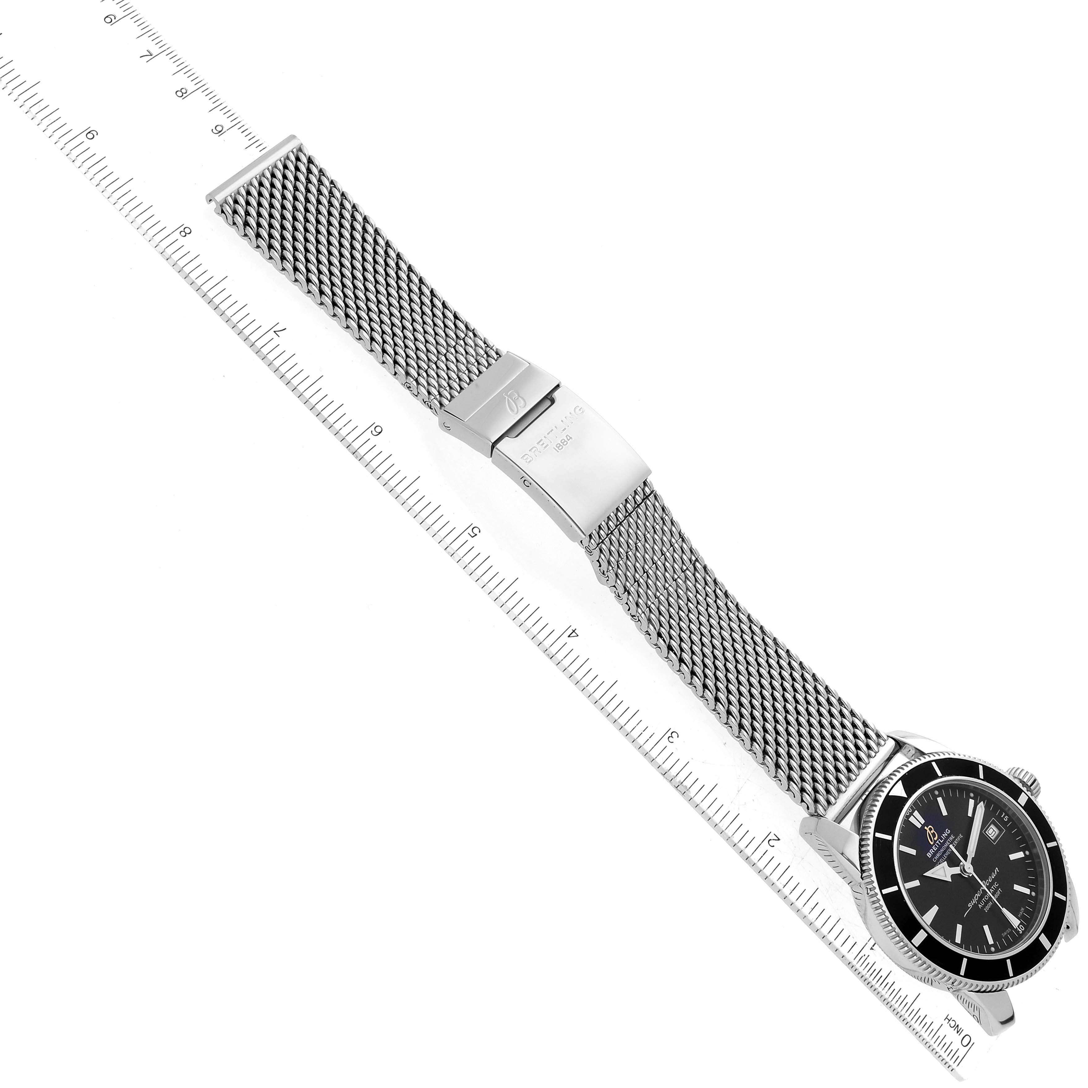 The image shows a Breitling Superocean A17321 Men
s Stainless Steel Black Dial A17321 Men
s Stainless Steel Black Dial watch at an oblique angle, featuring its mesh bracelet, clasp, and black dial.