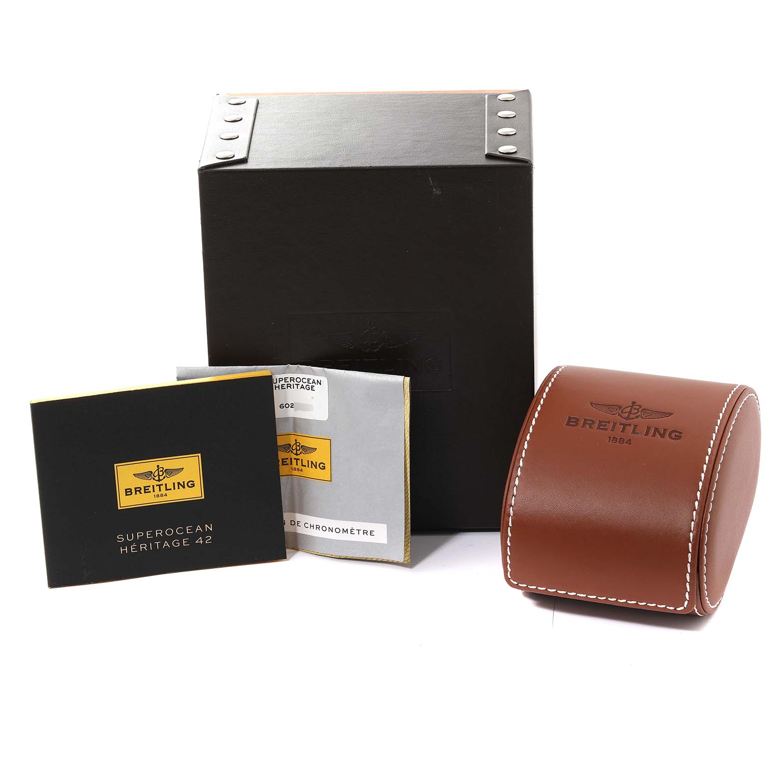 The image shows the packaging, manuals, and leather case for the Breitling Superocean A17321 Men
s Stainless Steel Black Dial A17321 Men
s Stainless Steel Black Dial watch model.