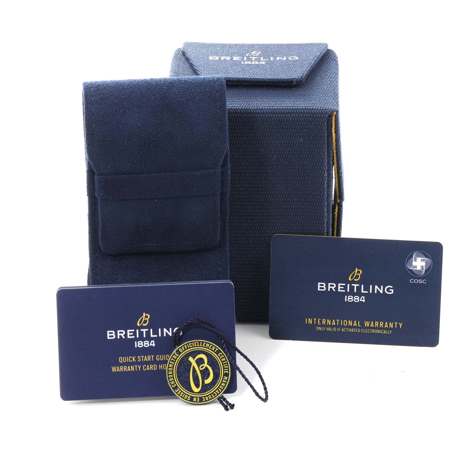 The image shows packaging accessories for the Breitling Superocean AB2020 Men's Stainless Steel Blue Dial AB2020 Men's Stainless Steel Blue Dial, including a box, travel case, warranty card, and tags.