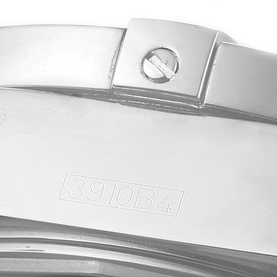 This is a close-up view of the Breitling Windrider A49350 Men's Stainless Steel Black Dial A49350 Men's Stainless Steel Black Dial model, showing a portion of the watch case with a screw and an engraved serial number "3910B4".