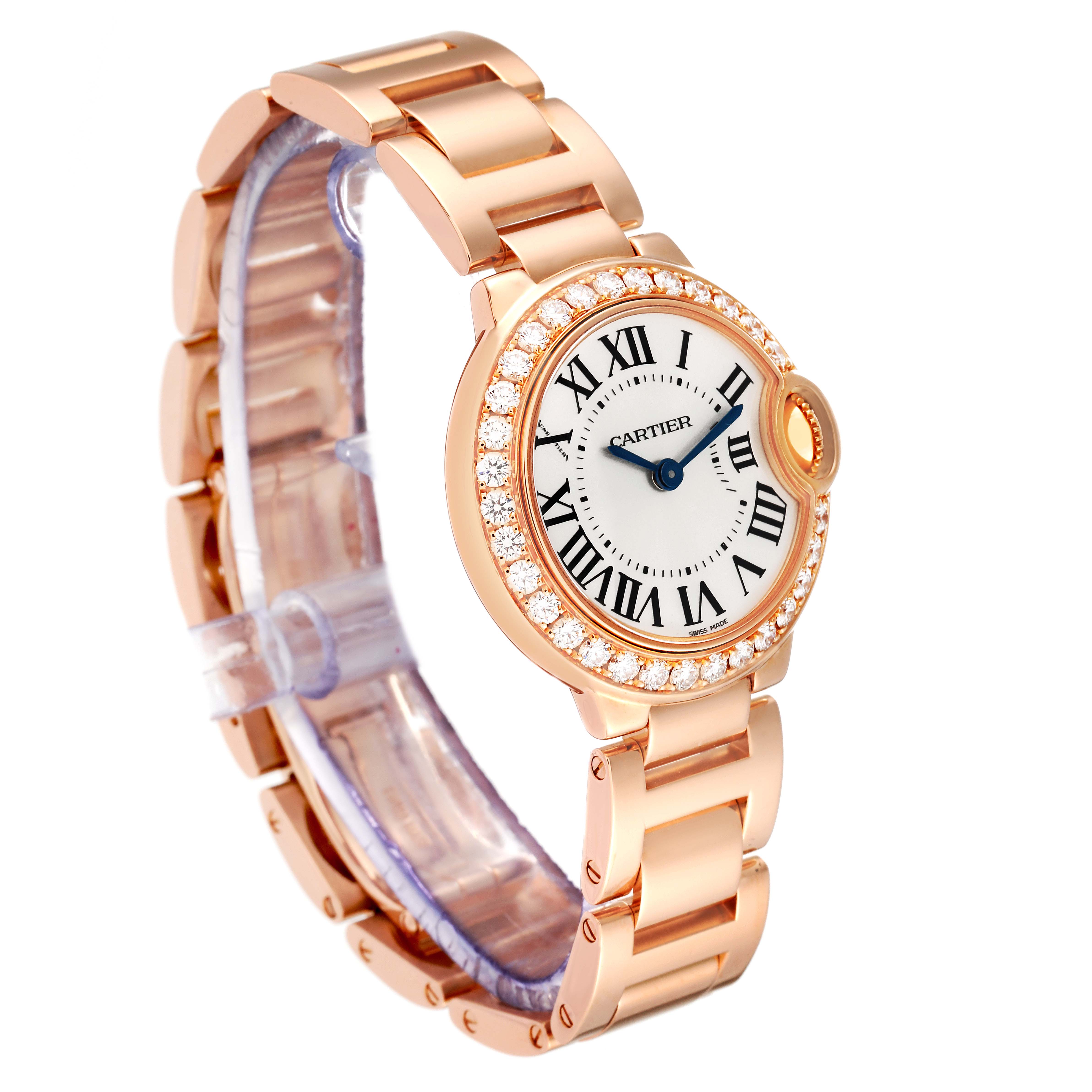 The image shows a Cartier Ballon Bleu WE9002Z3 Women
s Rose Gold Silver Dial WE9002Z3 Women
s Rose Gold Silver Dial watch with a gold bracelet, diamond-studded bezel, and Roman numeral dial, viewed from a three-quarter angle.