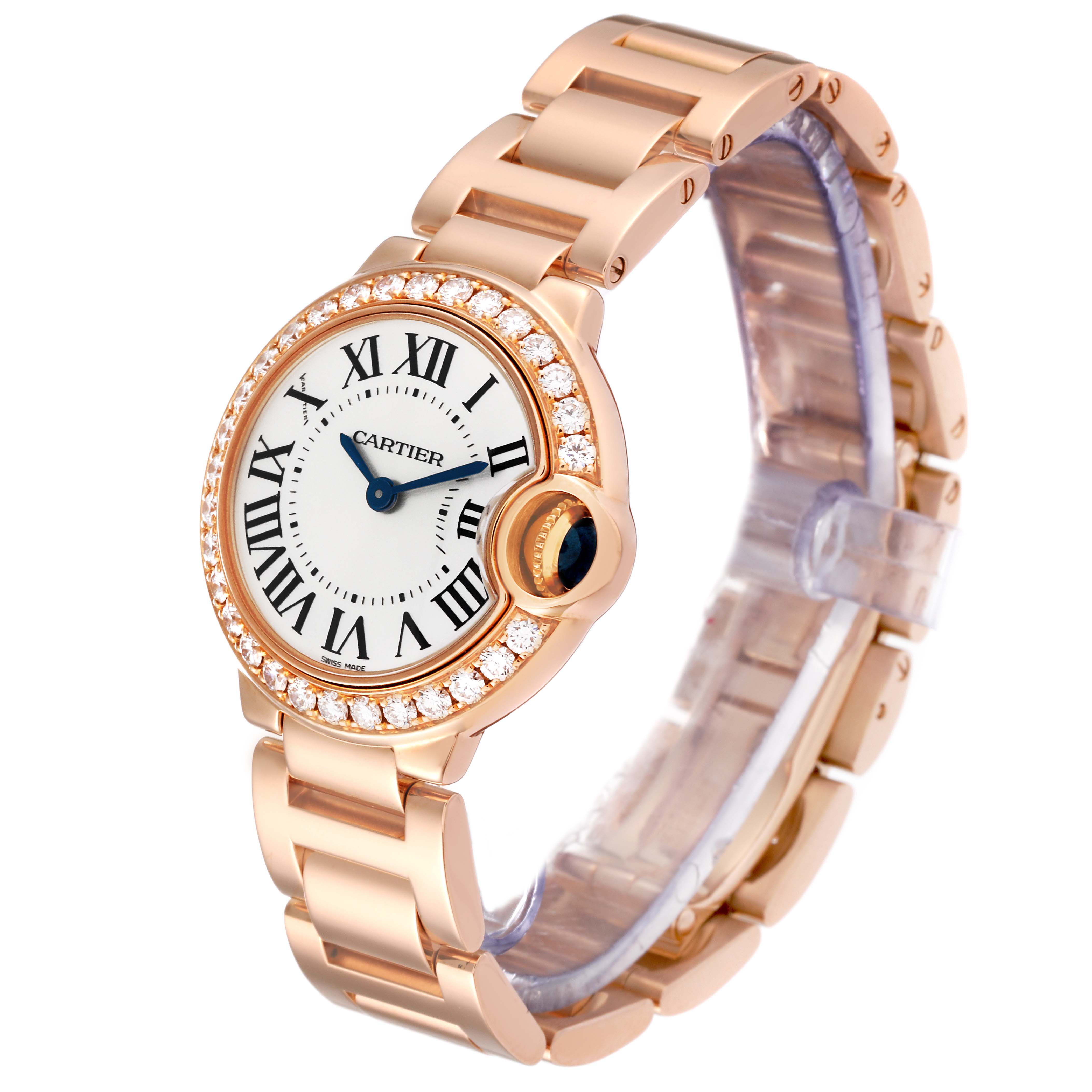 The Cartier Ballon Bleu WE9002Z3 Women
s Rose Gold Silver Dial WE9002Z3 Women
s Rose Gold Silver Dial watch is shown from a side angle, fully displaying its rose gold bracelet, diamond bezel, and face.
