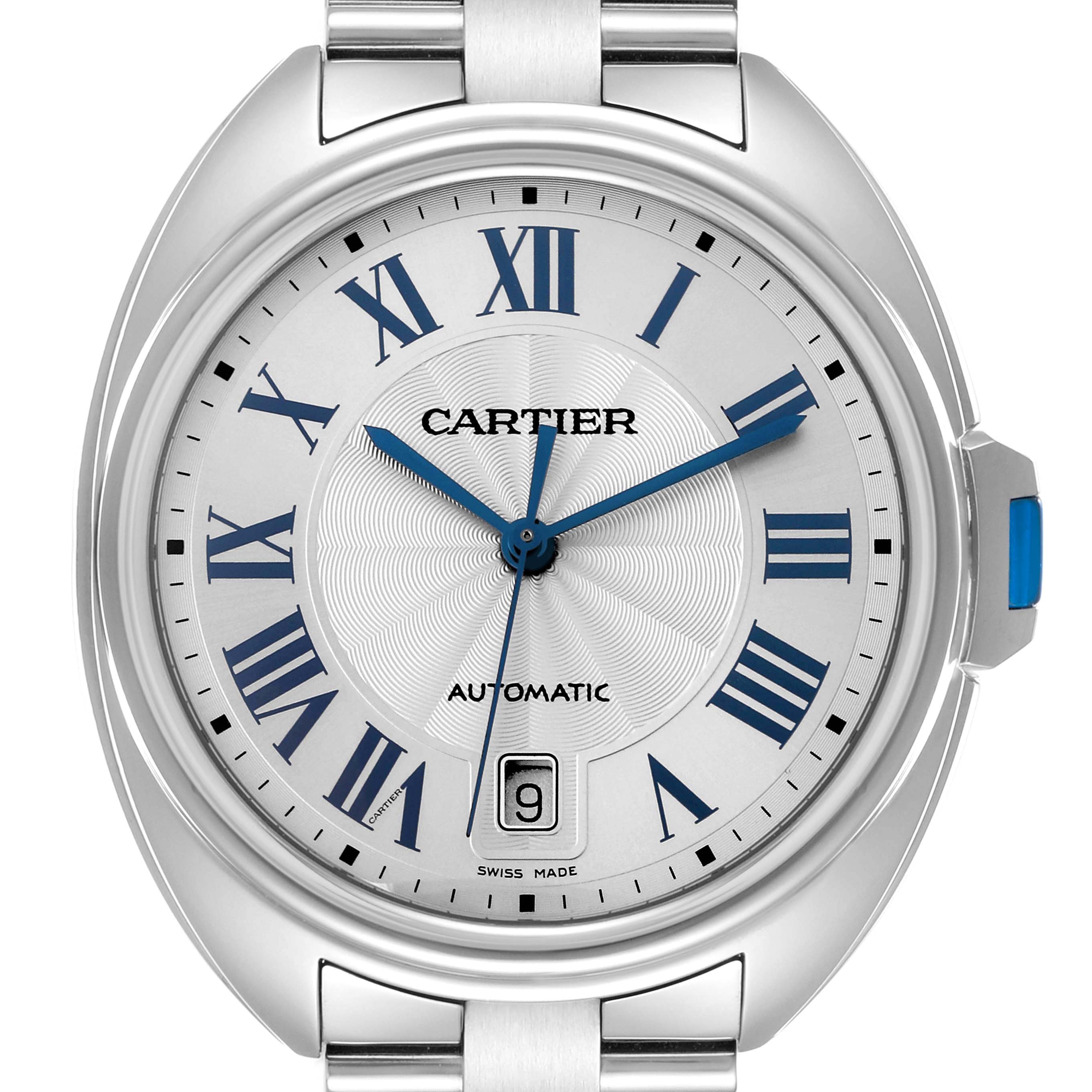 The Cartier Clé watch is shown from a front view, displaying its dial, Roman numerals, blue hands, and date window.