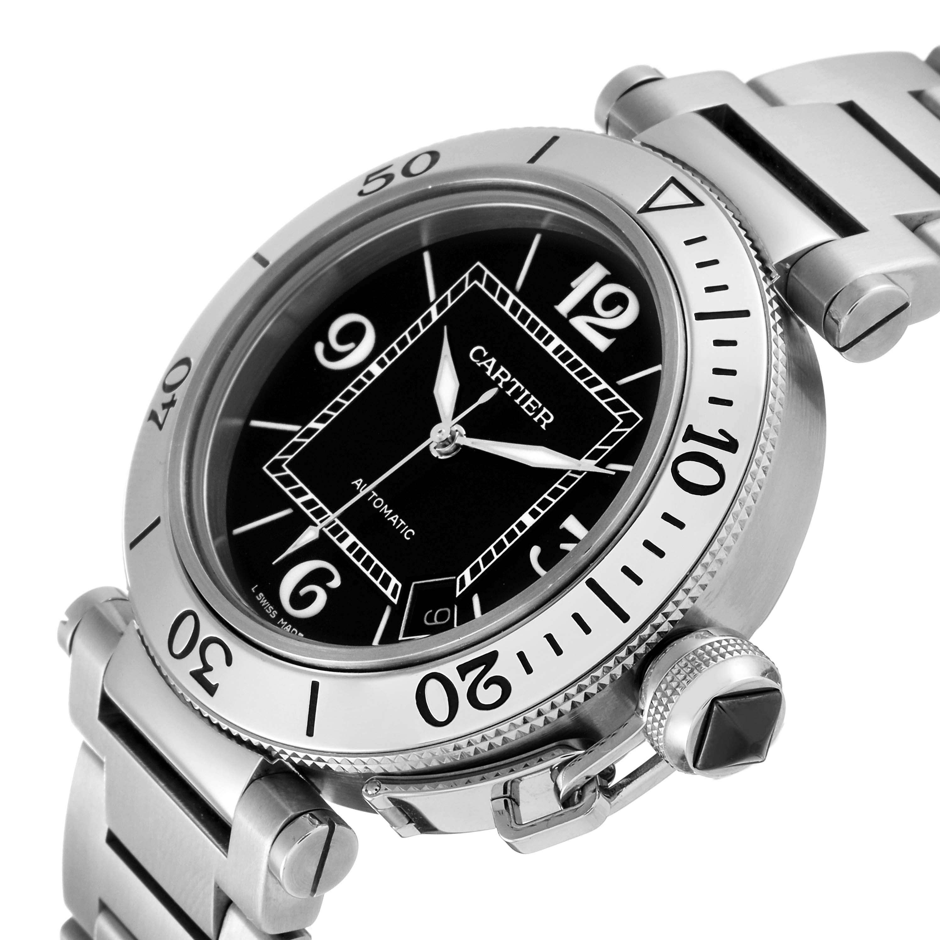 The Pasha model by Cartier is shown from a three-quarter angle, highlighting the dial, bezel, bracelet, and crown.