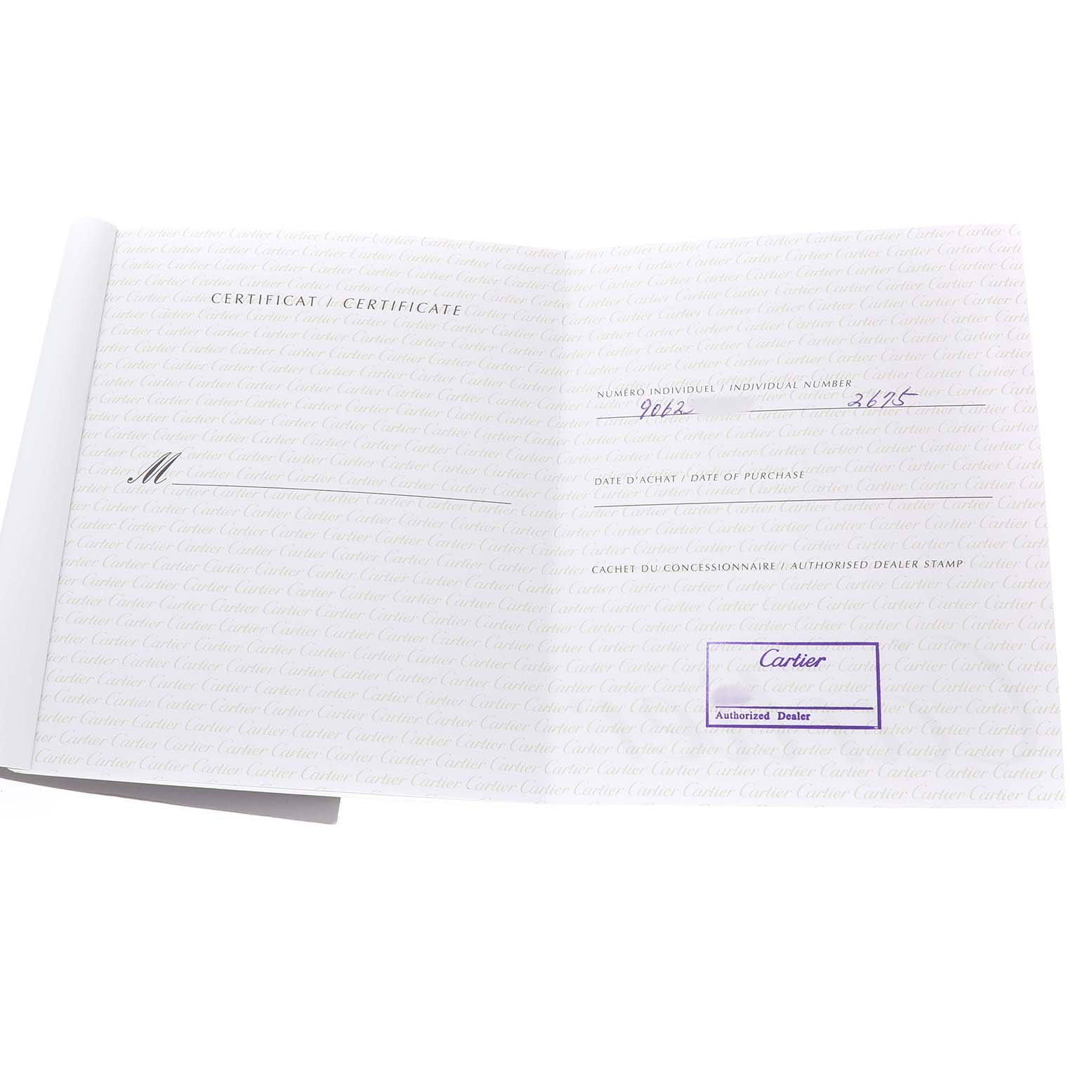 The image shows an open Cartier certificate booklet for the Roadster model, with handwritten details and dealer stamp.