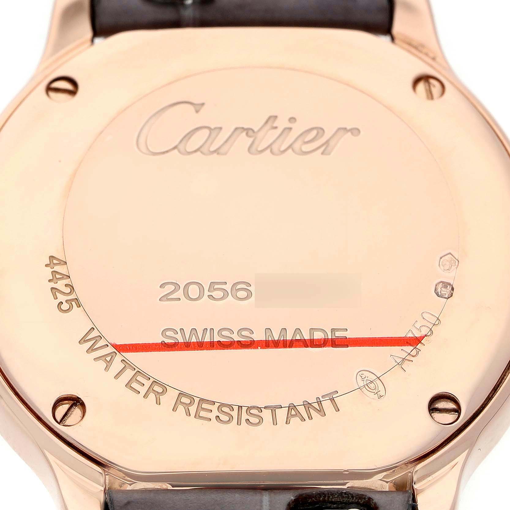 The image shows the back of a Cartier Ronde WGRN0013 Women's Rose Gold Silver Dial watch, featuring engravings and a leather strap attachment.