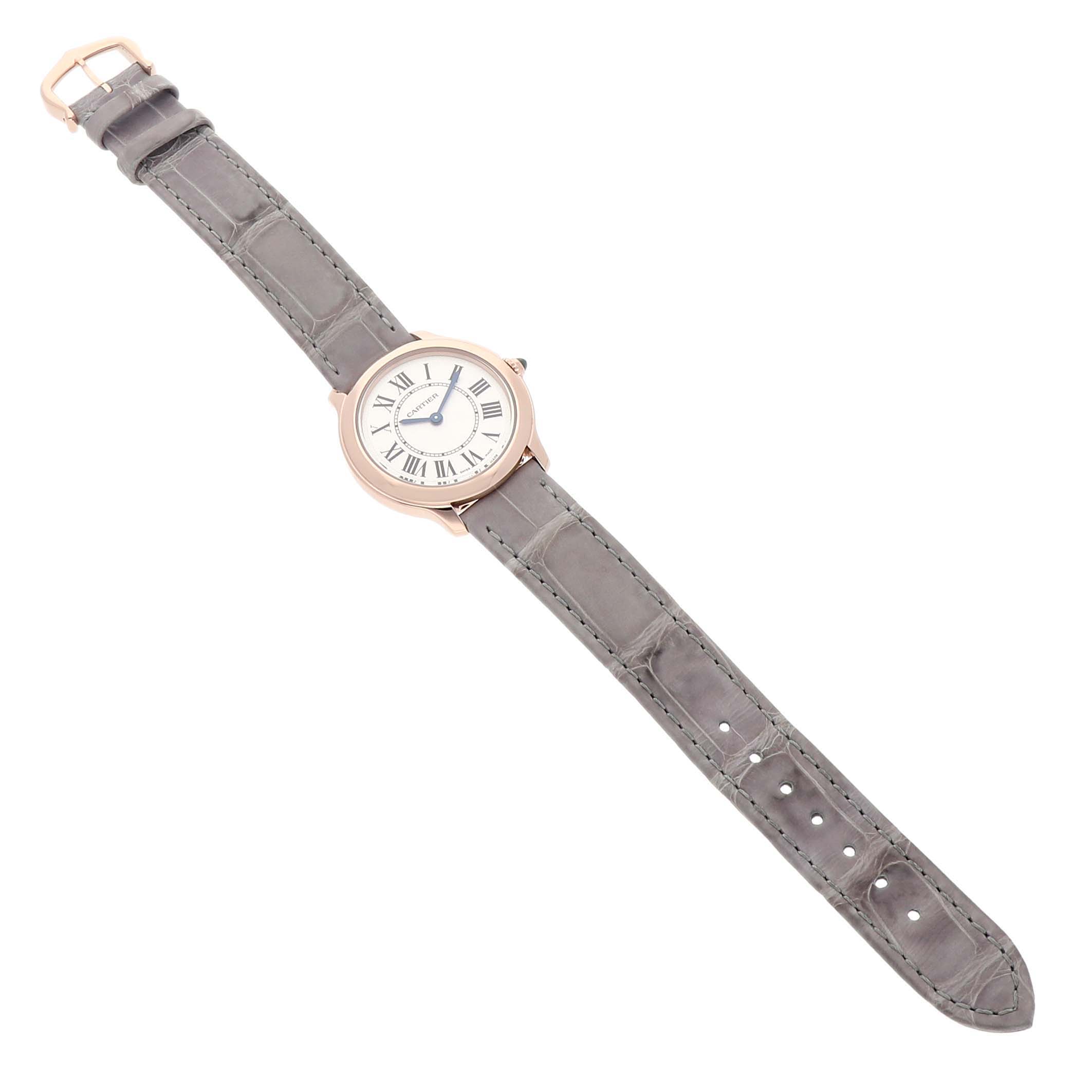 The Cartier Ronde WGRN0013 Women's Rose Gold Silver Dial watch is shown from a top-down angle, displaying its round face and leather strap.