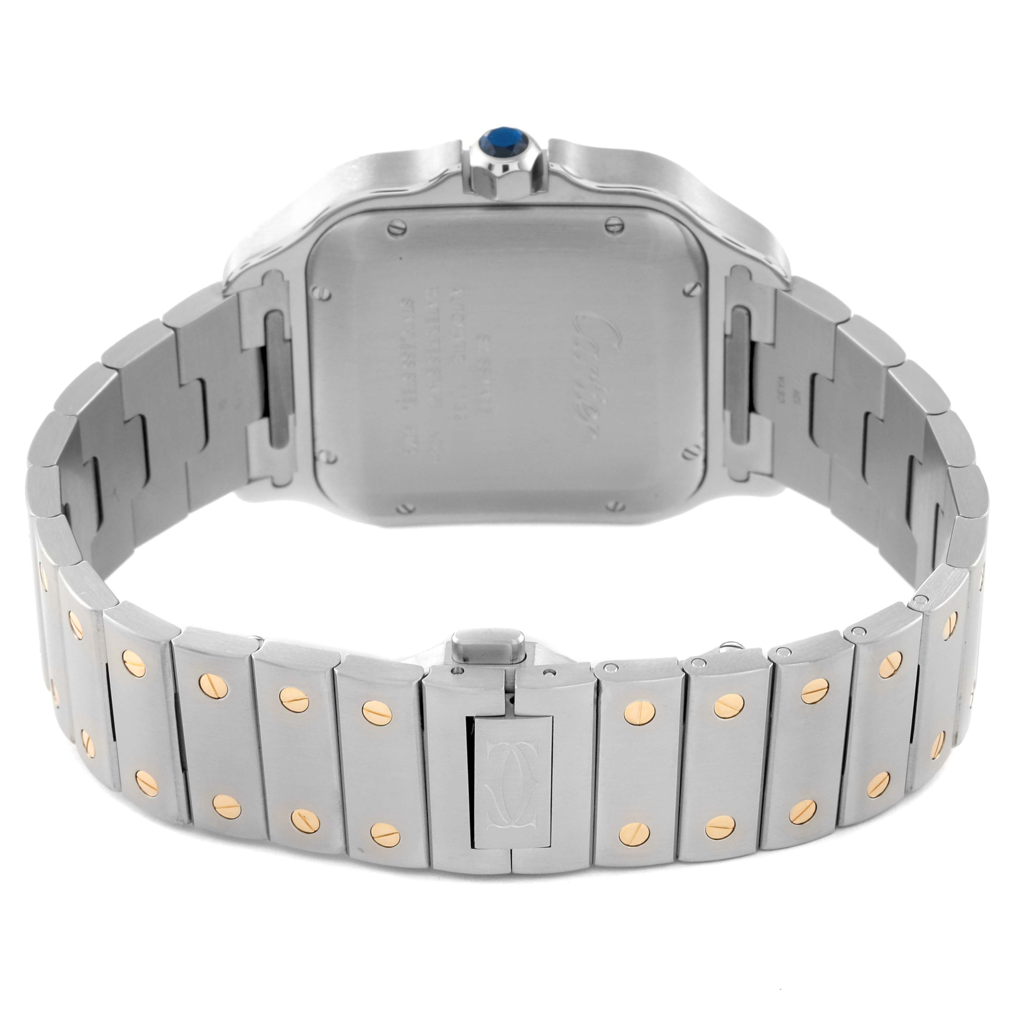 The image shows the back case and bracelet of a Cartier Santos W2SA0006 Men's Steel and Gold (two tone) Silver Dial W2SA0006 Men's Steel and Gold (two tone) Silver Dial watch, highlighting its metallic links and clasp.